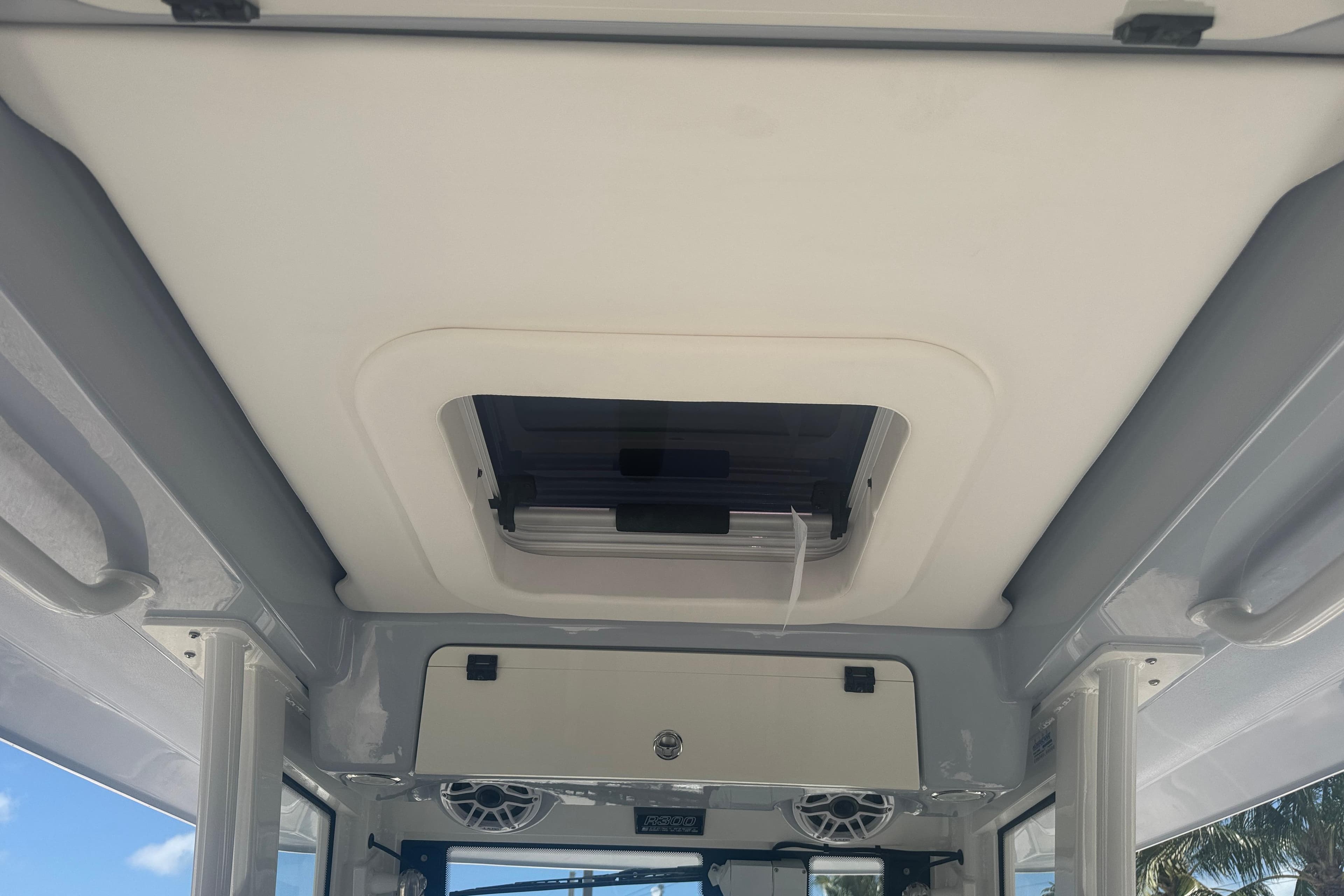 2025 Robalo R300 Center Console boat interior ceiling with hatch and speakers.