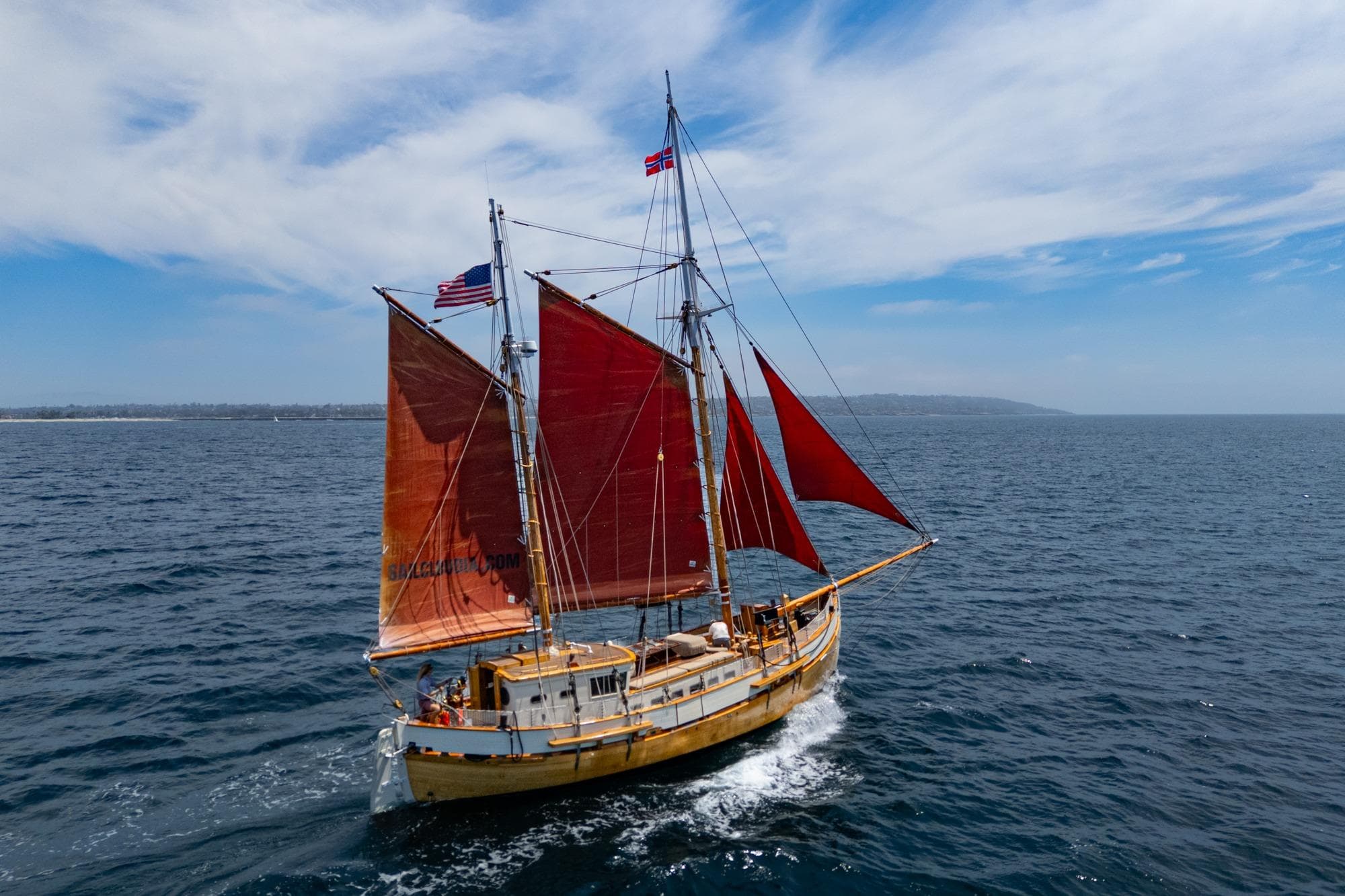 Vintage 1938 Norwegian Double Ended Ketch sailing on open sea under clear skies.