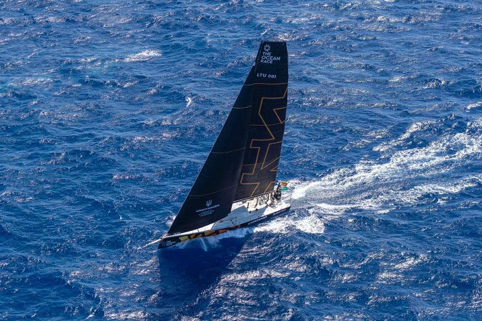 Sailing yacht Volvo Ocean 65 navigating through deep blue ocean waters, 2013 model.