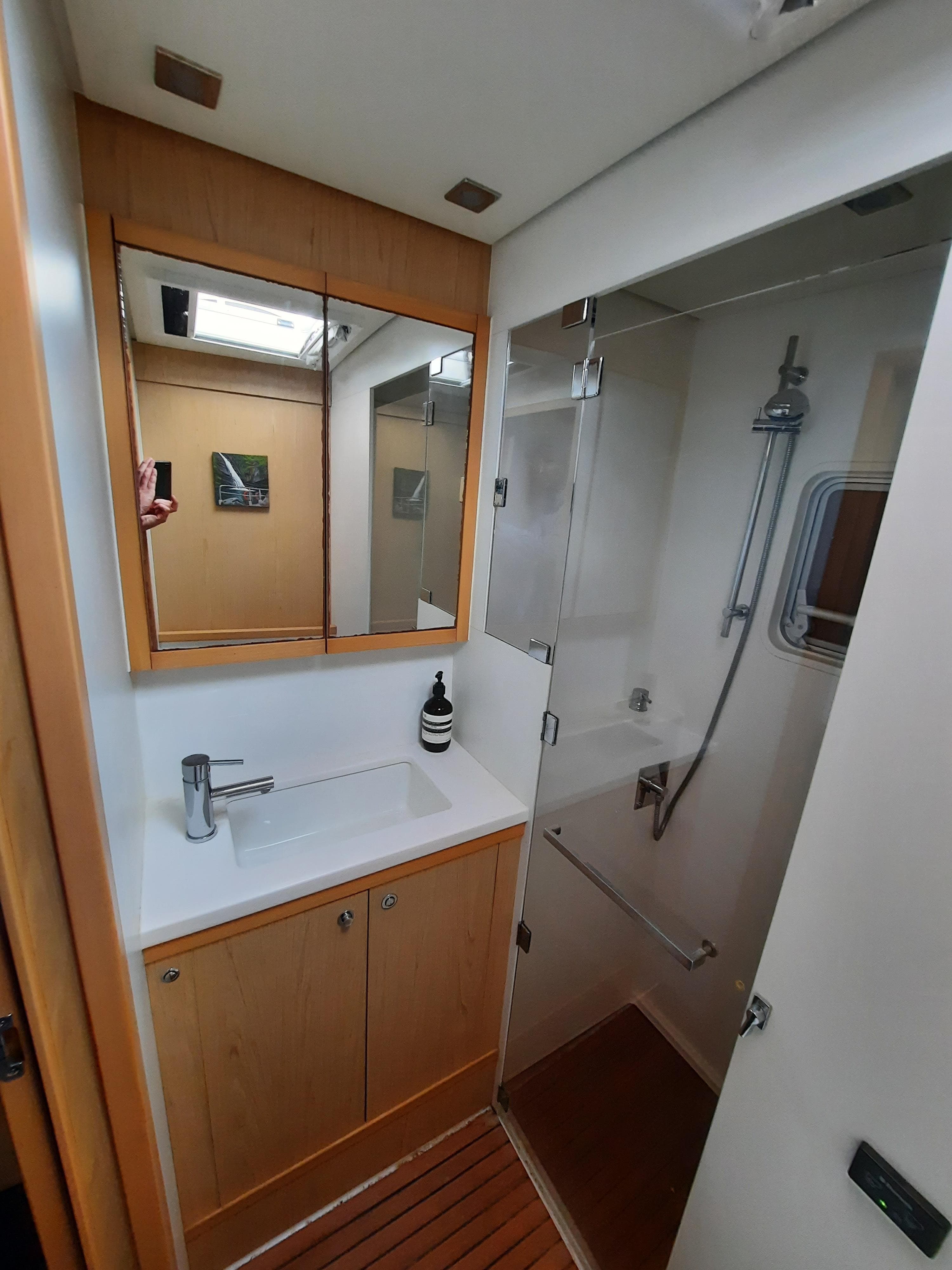 Bathroom interior of 2013 Lagoon 52 F yacht with shower and vanity.