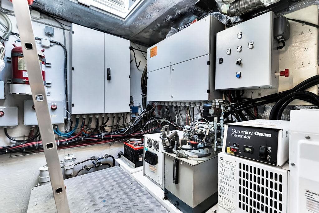 Engine room of 2018 Sunreef 68 Supreme yacht with Cummins Onan generator and control panels.