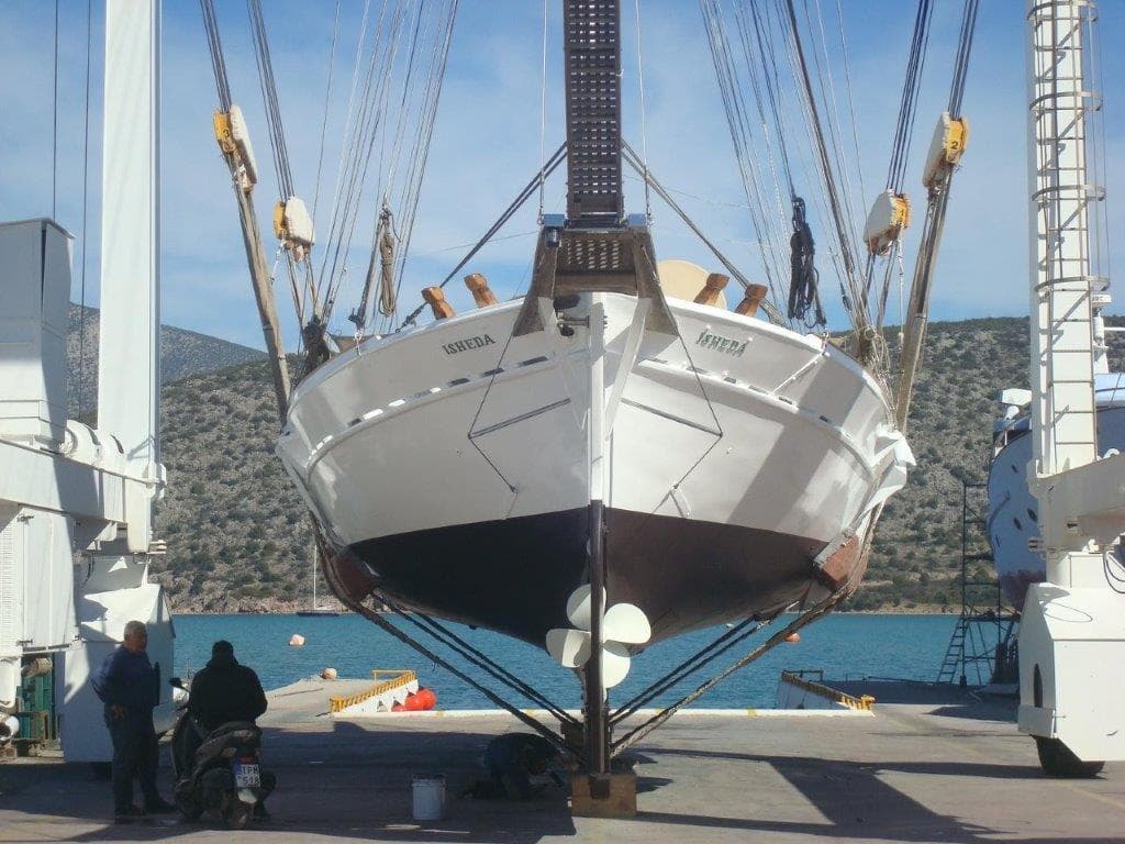 Custom 1994 Motor Sailer in dry dock, with scenic coastal background.