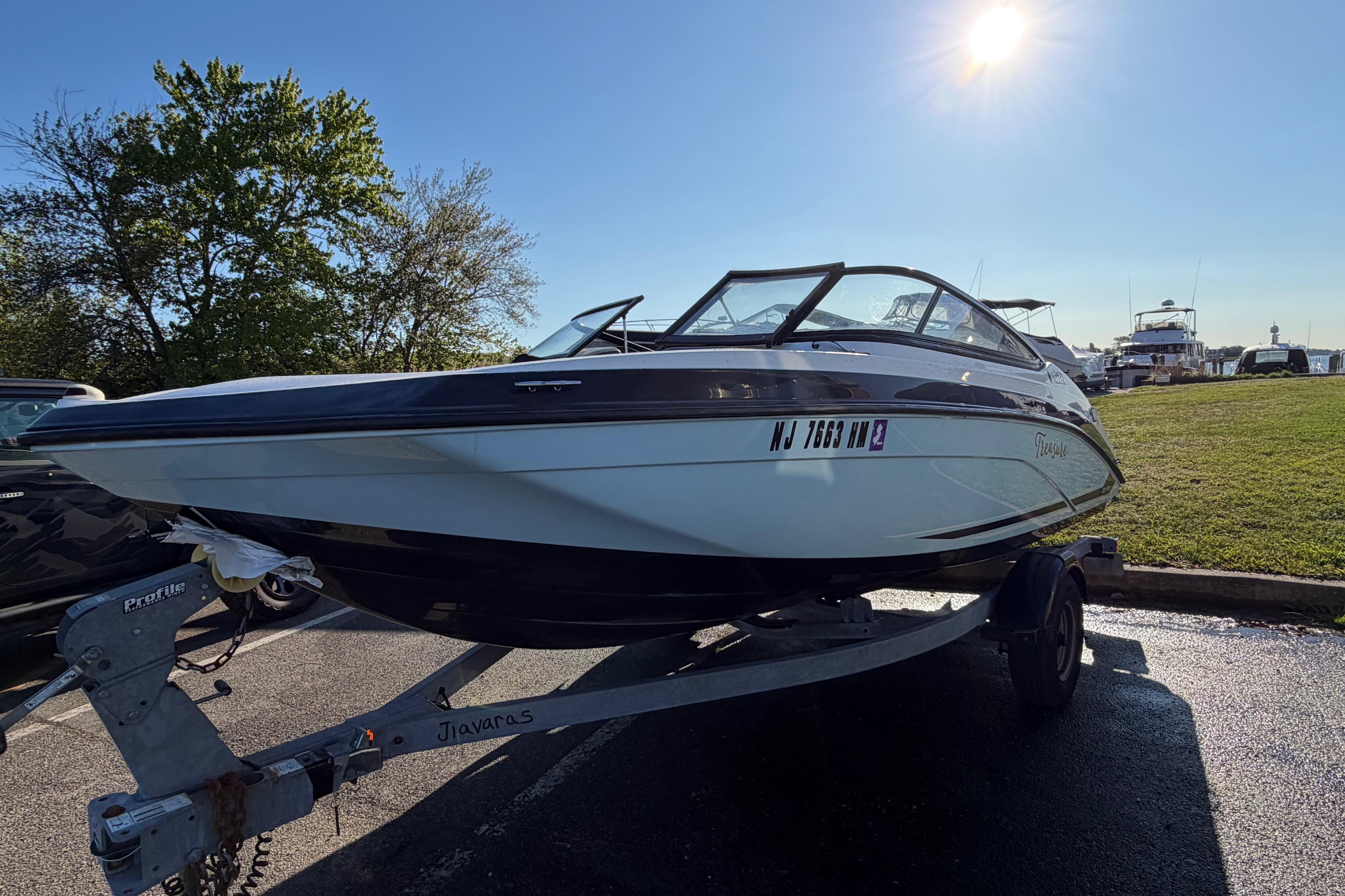 2019 Yamaha Boats SX190 on trailer in sunny outdoor setting.