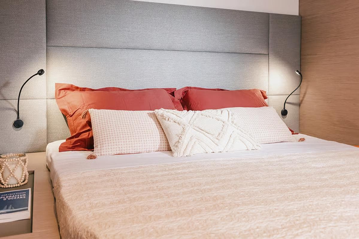 Manufacturer Provided Image: Luxurious bedroom interior of 2026 Fountaine Pajot Aura 51 Catamaran with elegant bedding.
