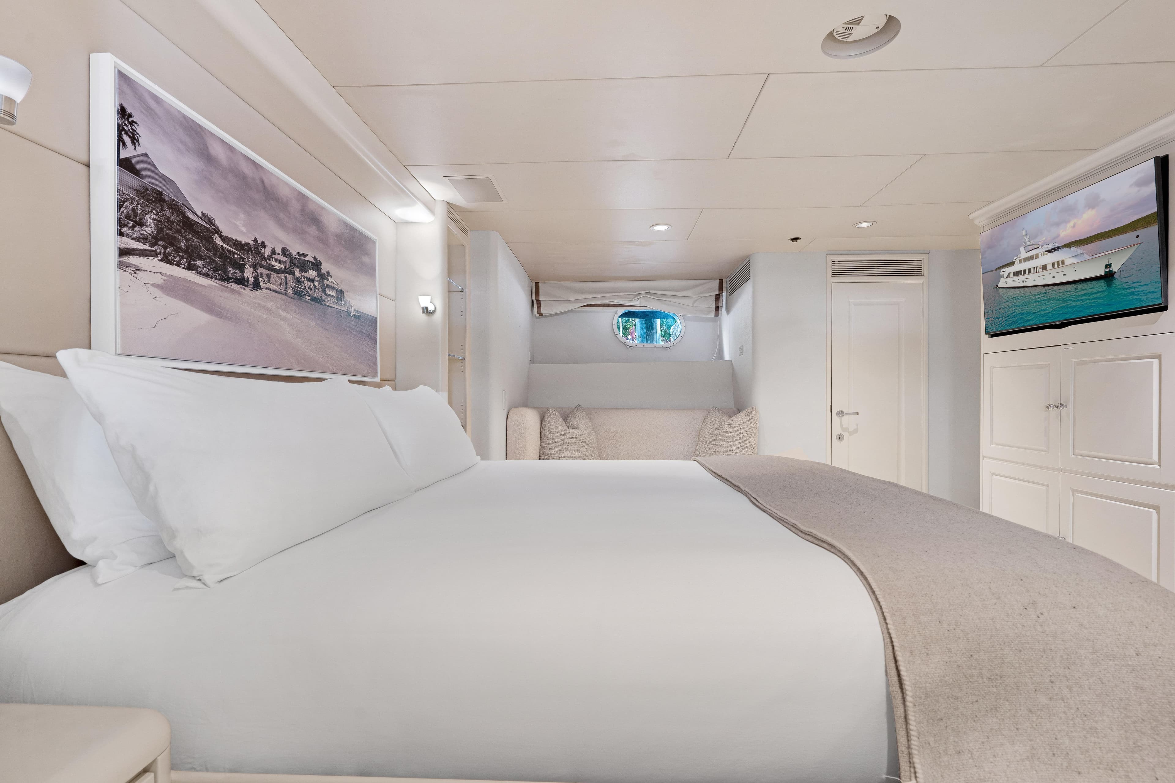 Luxurious bedroom interior on 1995 Christensen Tri-Deck yacht, featuring elegant decor and modern amenities.