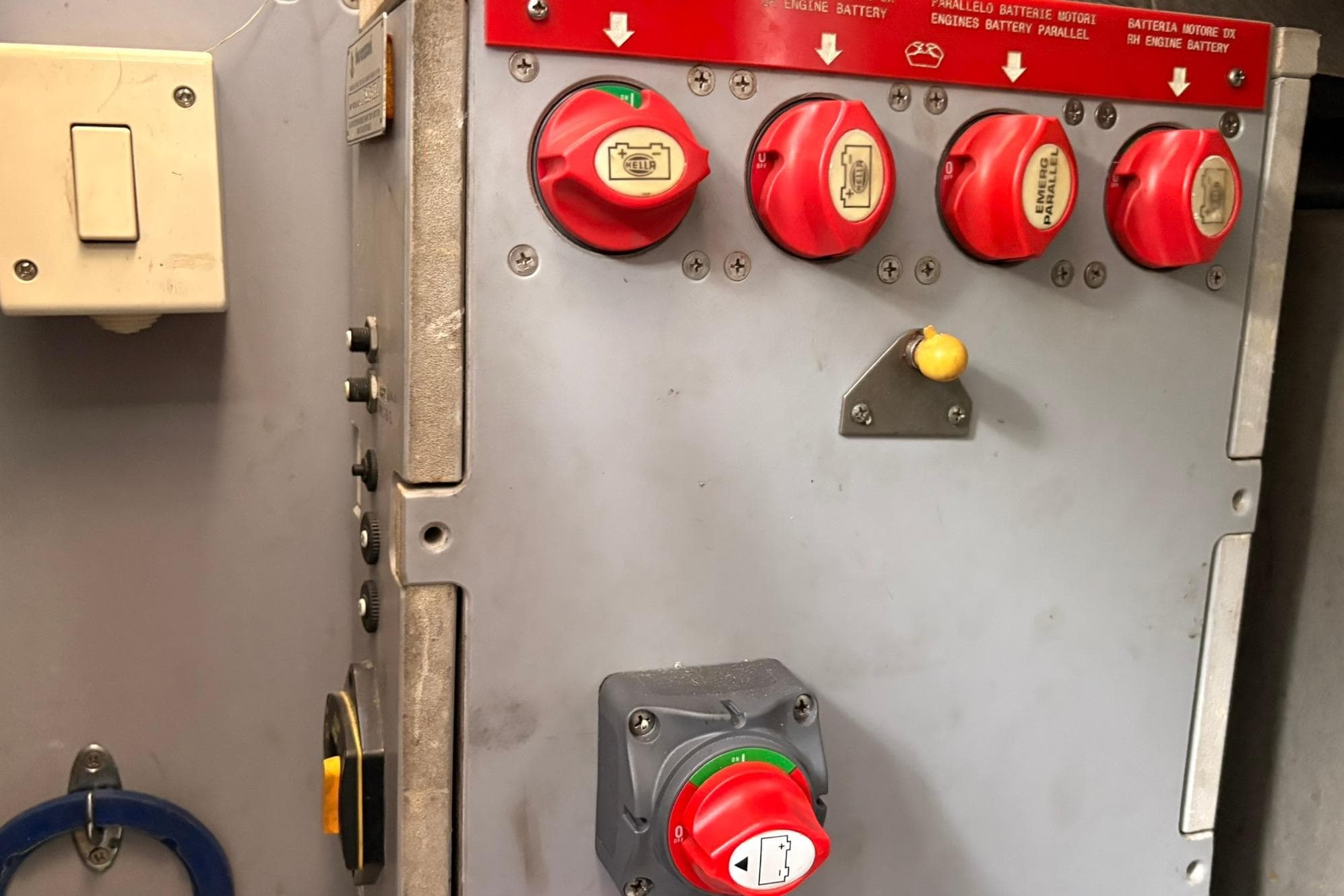 Control panel with red switches on a 2014 Cranchi M44 HT Hard Top boat.