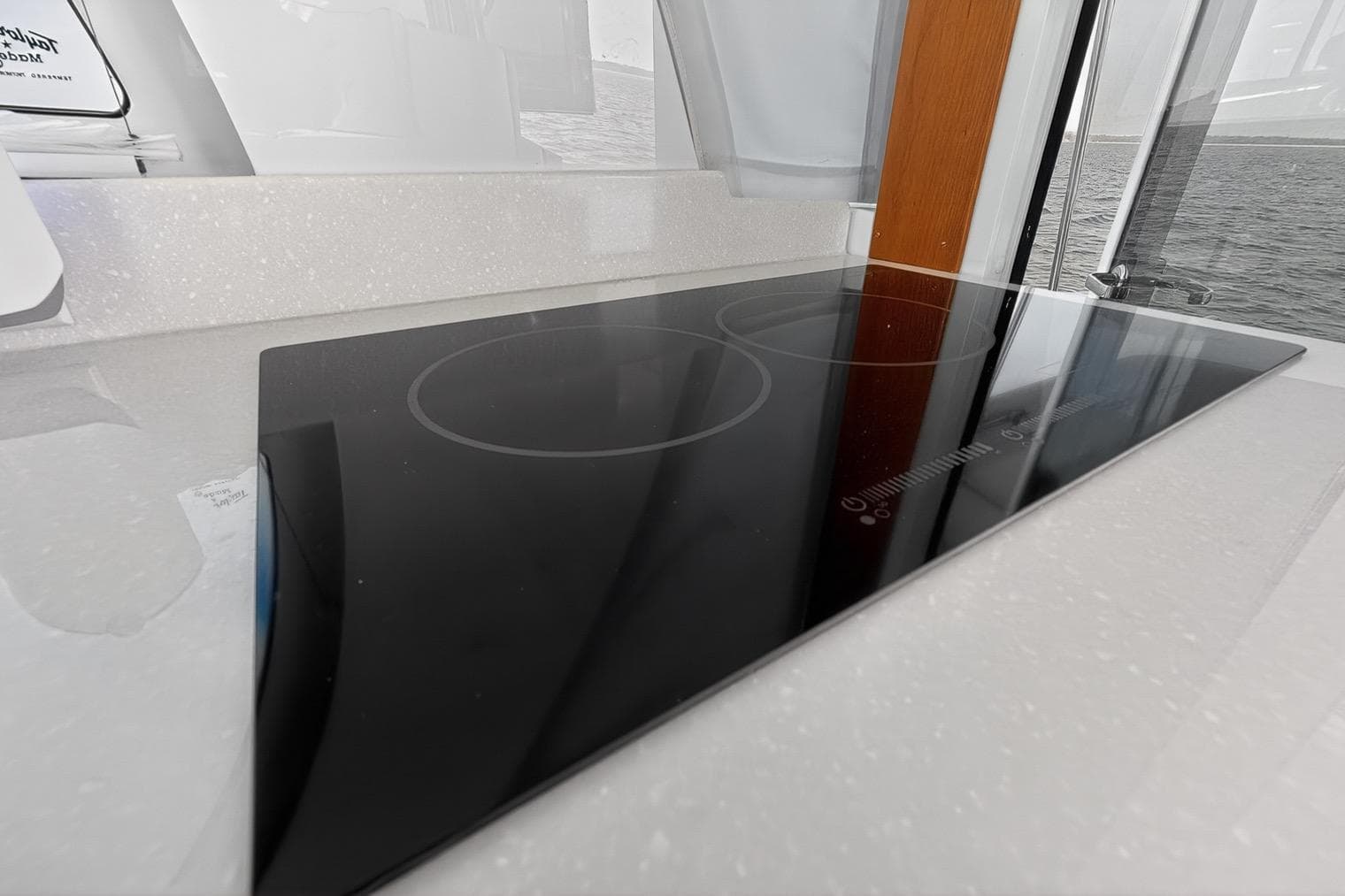 Sleek induction cooktop on 2024 Back Cove 39O yacht, featuring modern design and functionality.