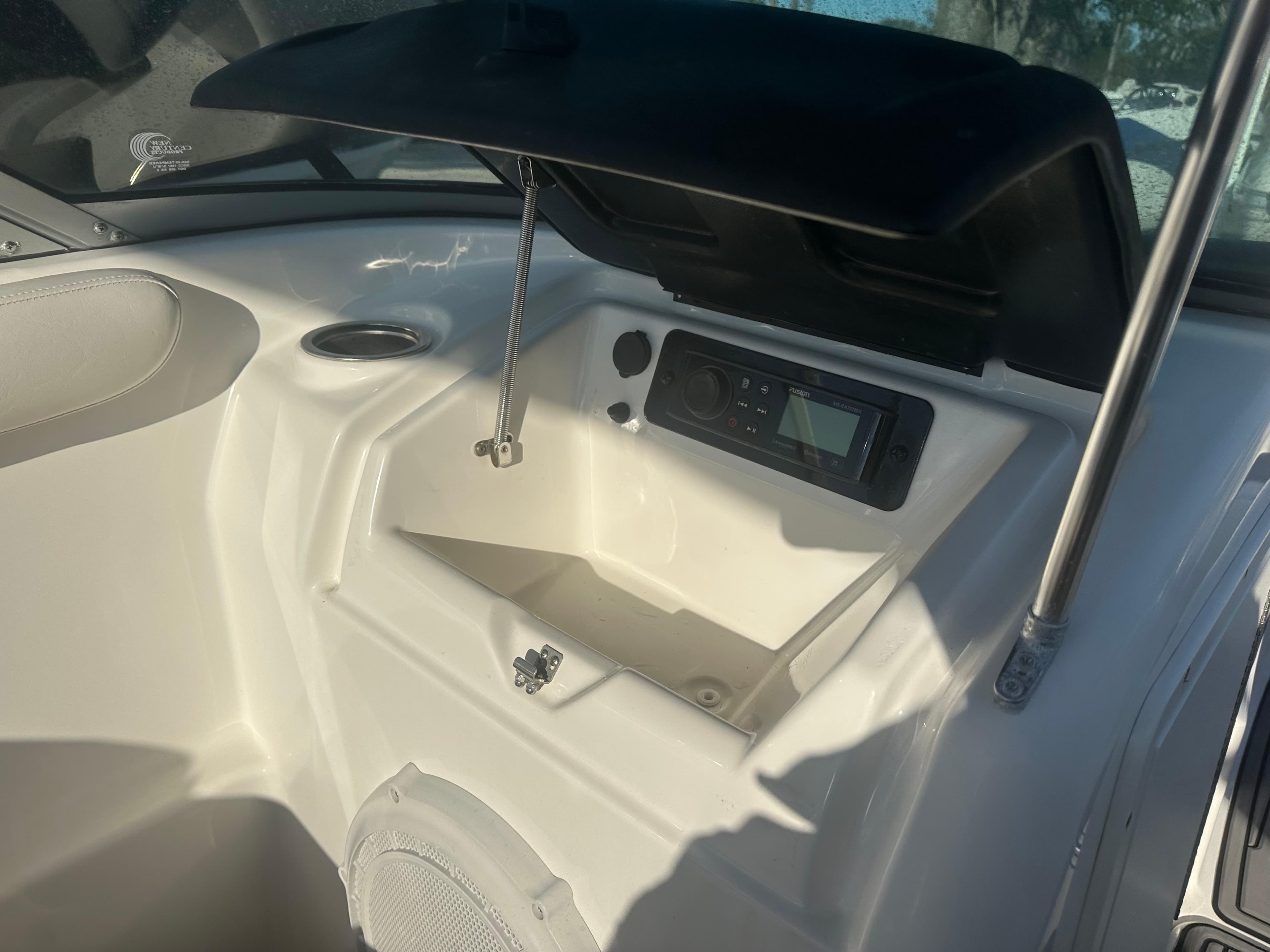 2013 Yamaha SX192 boat dashboard with open storage compartment and audio system.