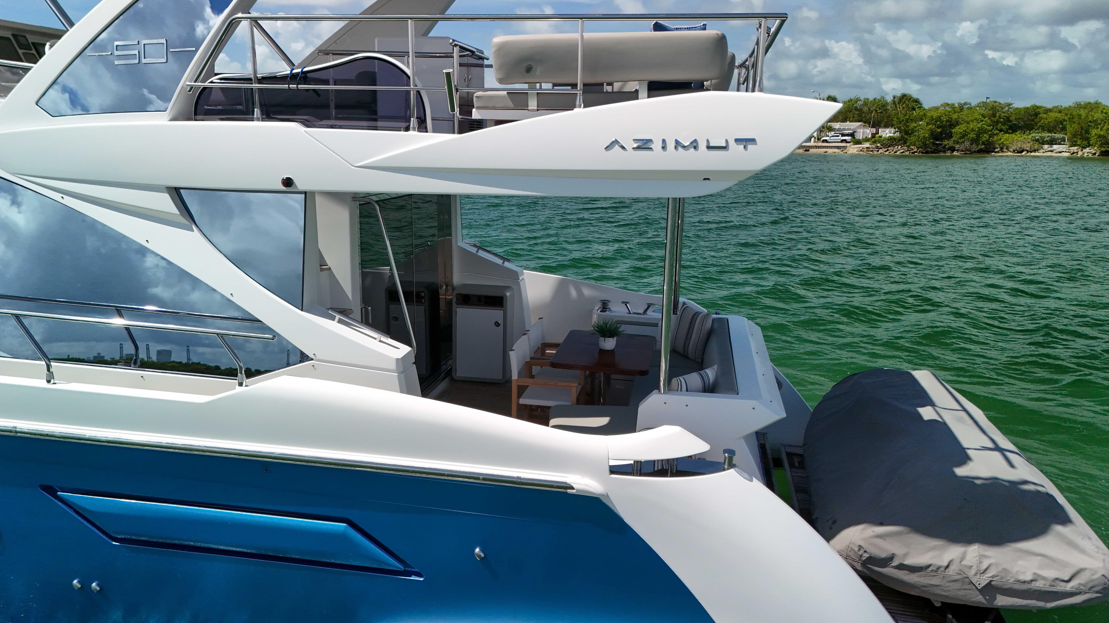 Azimut 50 Flybridge 2016 yacht on water, featuring sleek design and spacious deck.