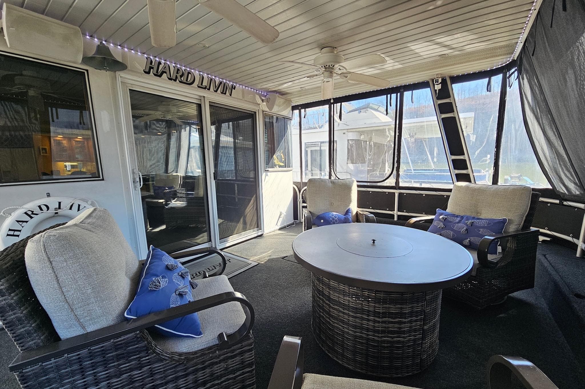 Luxurious 2001 Sumerset 16x79 houseboat interior with cozy seating and stylish decor.