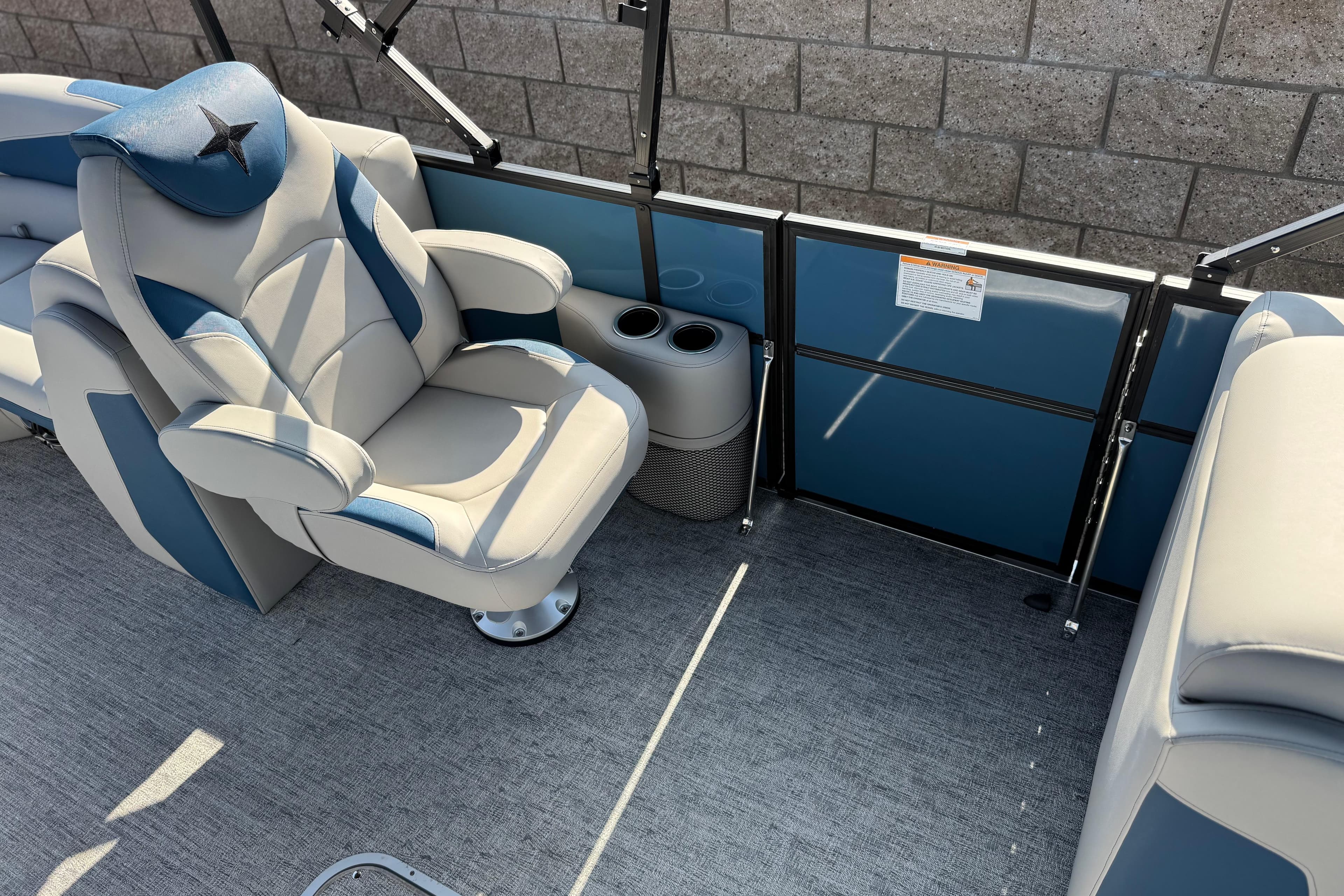 Luxurious seating on 2026 Berkshire 22RFX LE pontoon boat with cup holders and stylish design.