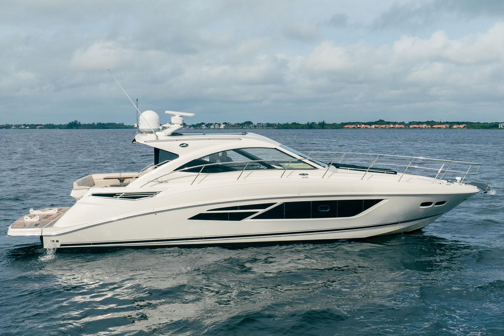 2015 Sea Ray 510 Sundancer yacht cruising on open water.