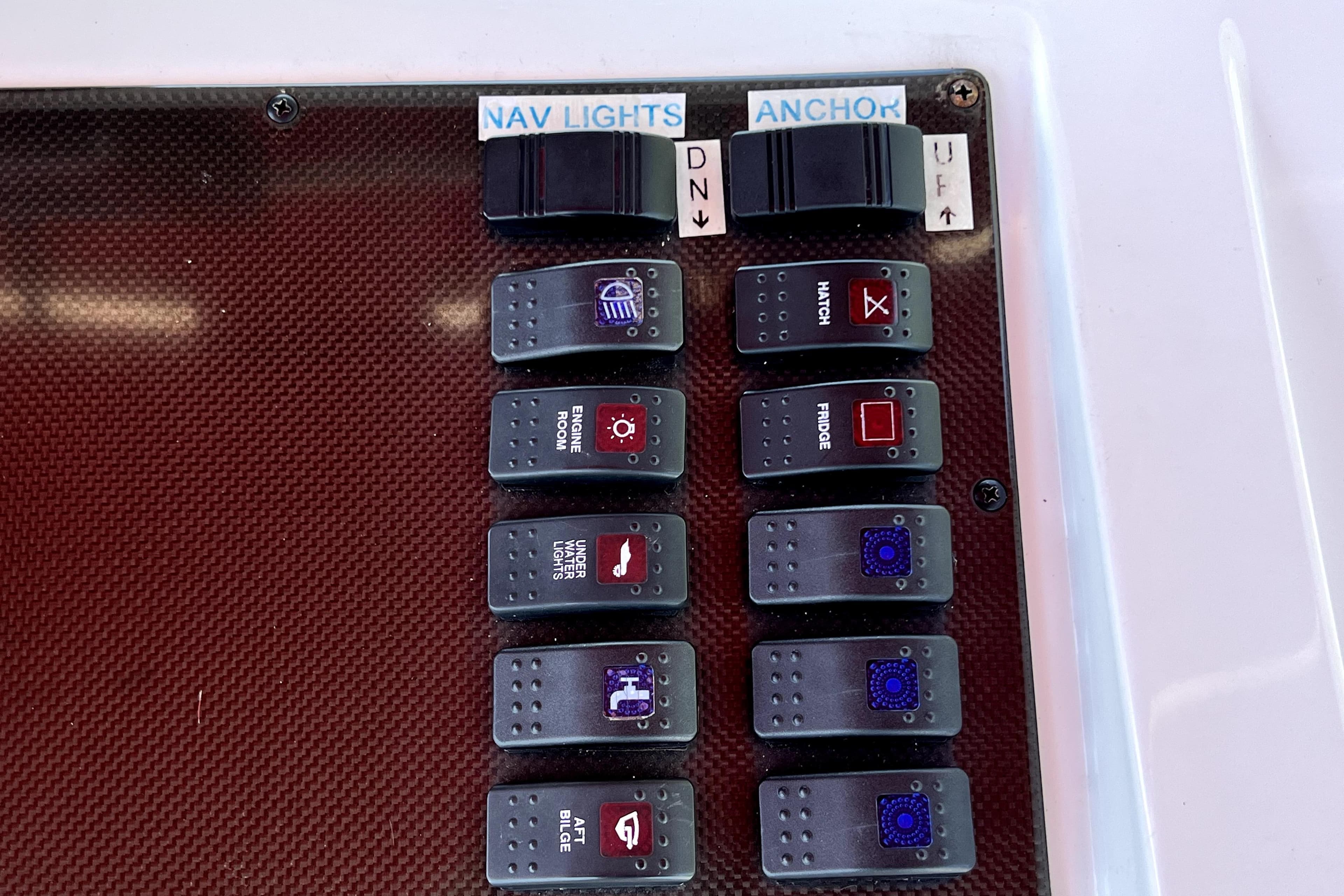 Control panel of a 2013 Novurania Chase 23 boat with labeled switches.