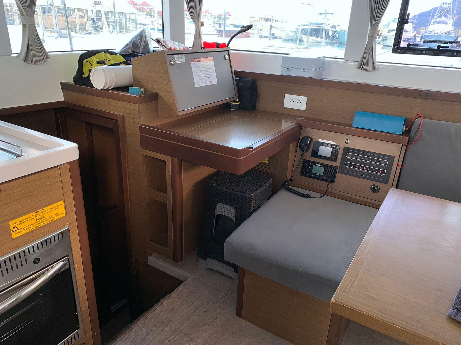Interior of 2020 Lagoon 40 catamaran with navigation station and seating area.