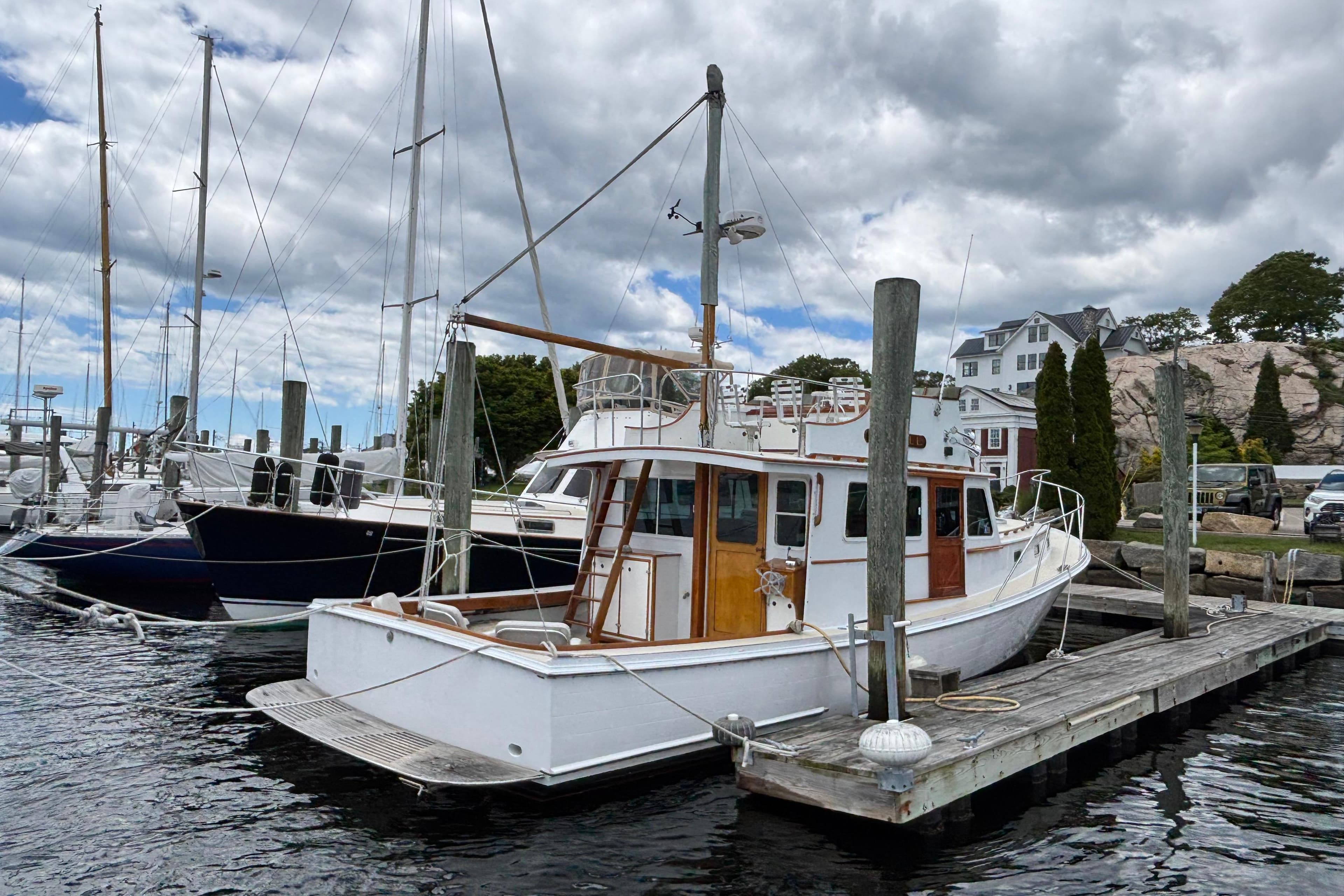 Lowell 40 boat docked at marina, cloudy sky, 2001 model.