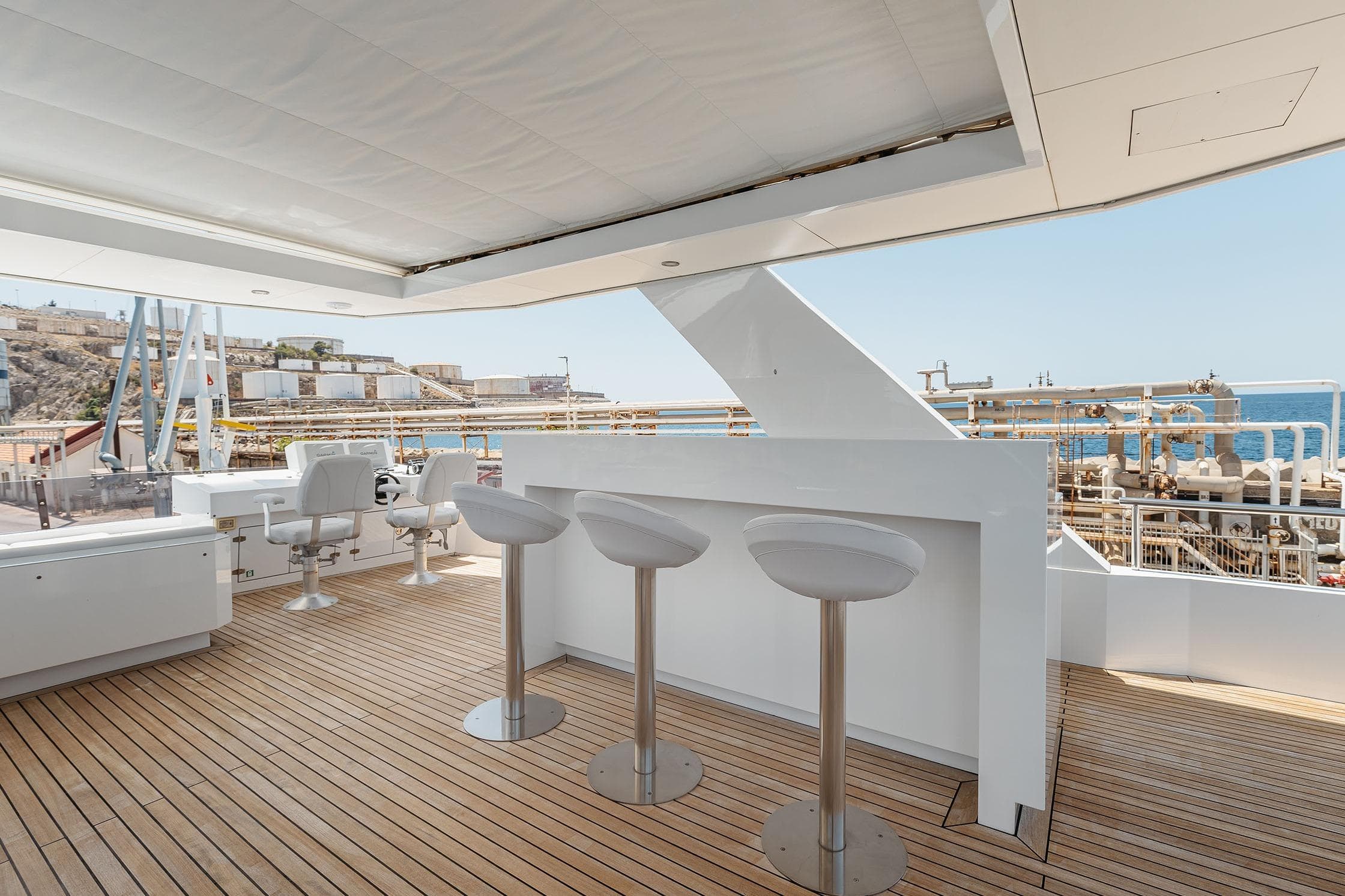 Luxurious deck of 2018 Arkin Pruva Argos Custom Explorer 27M yacht with bar stools.