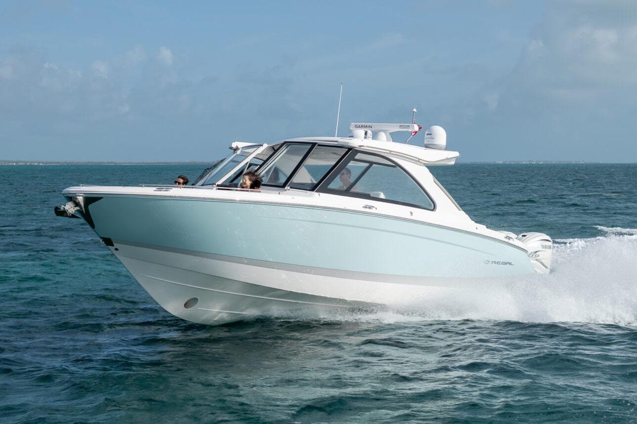Manufacturer Provided Image: 2026 Regal LX36 boat cruising on open water.