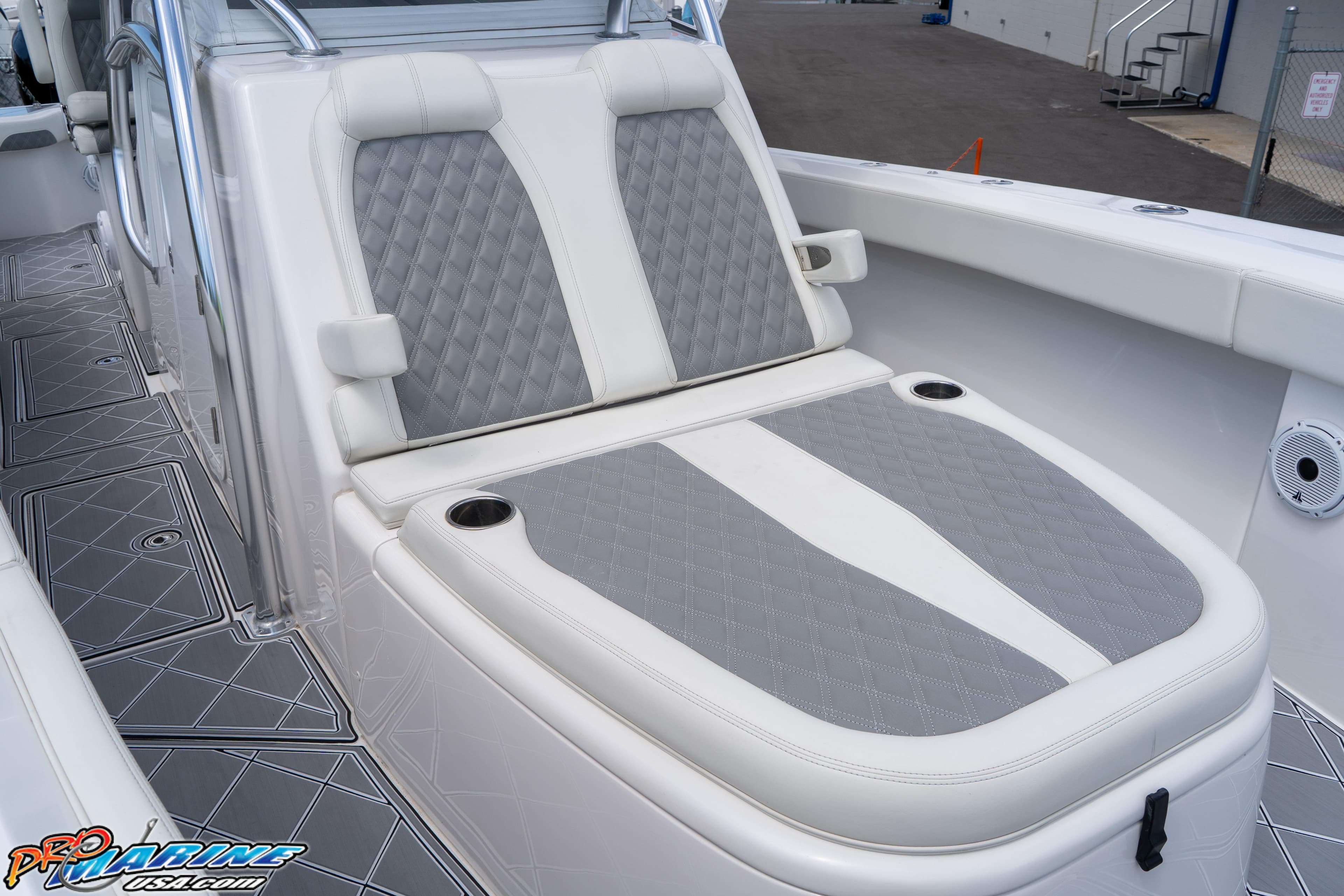 2023 Front Runner 36 Center Console boat with cushioned seating and cup holders.