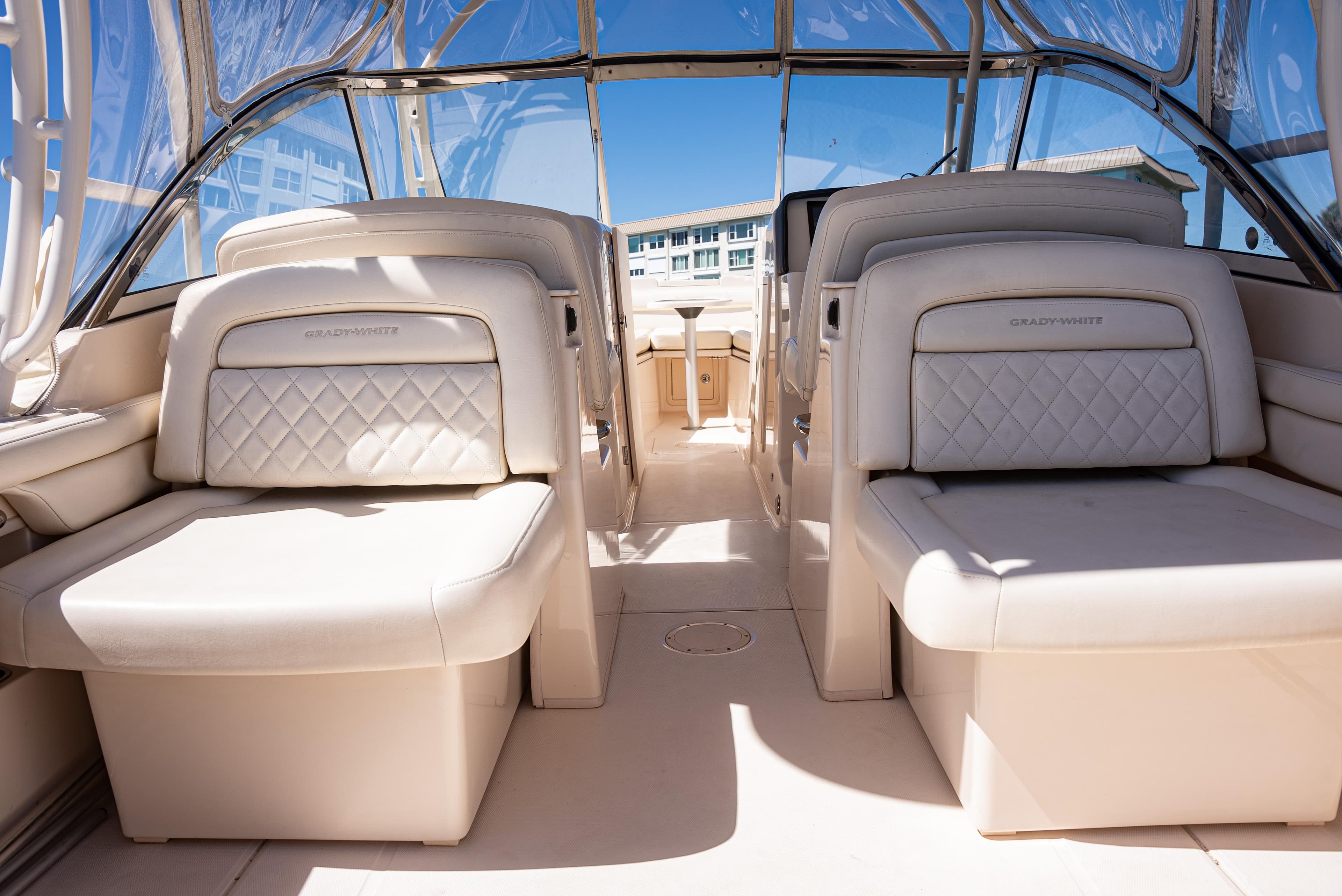 2020 Grady-White Freedom 285 boat interior with luxurious seating and clear canopy.