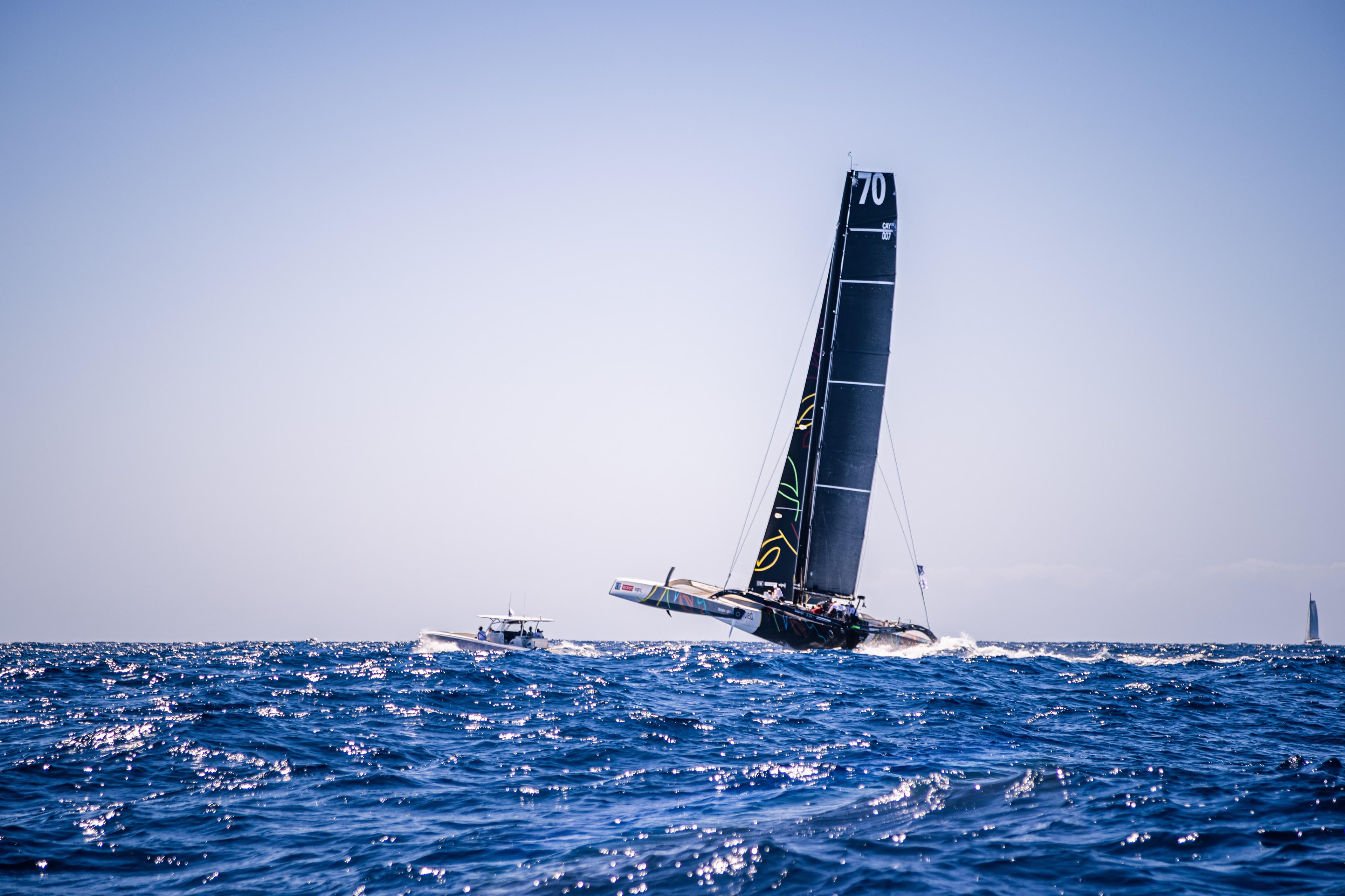 Sailing yacht CDK Technologies MOD 70 racing on open sea, 2011 model.