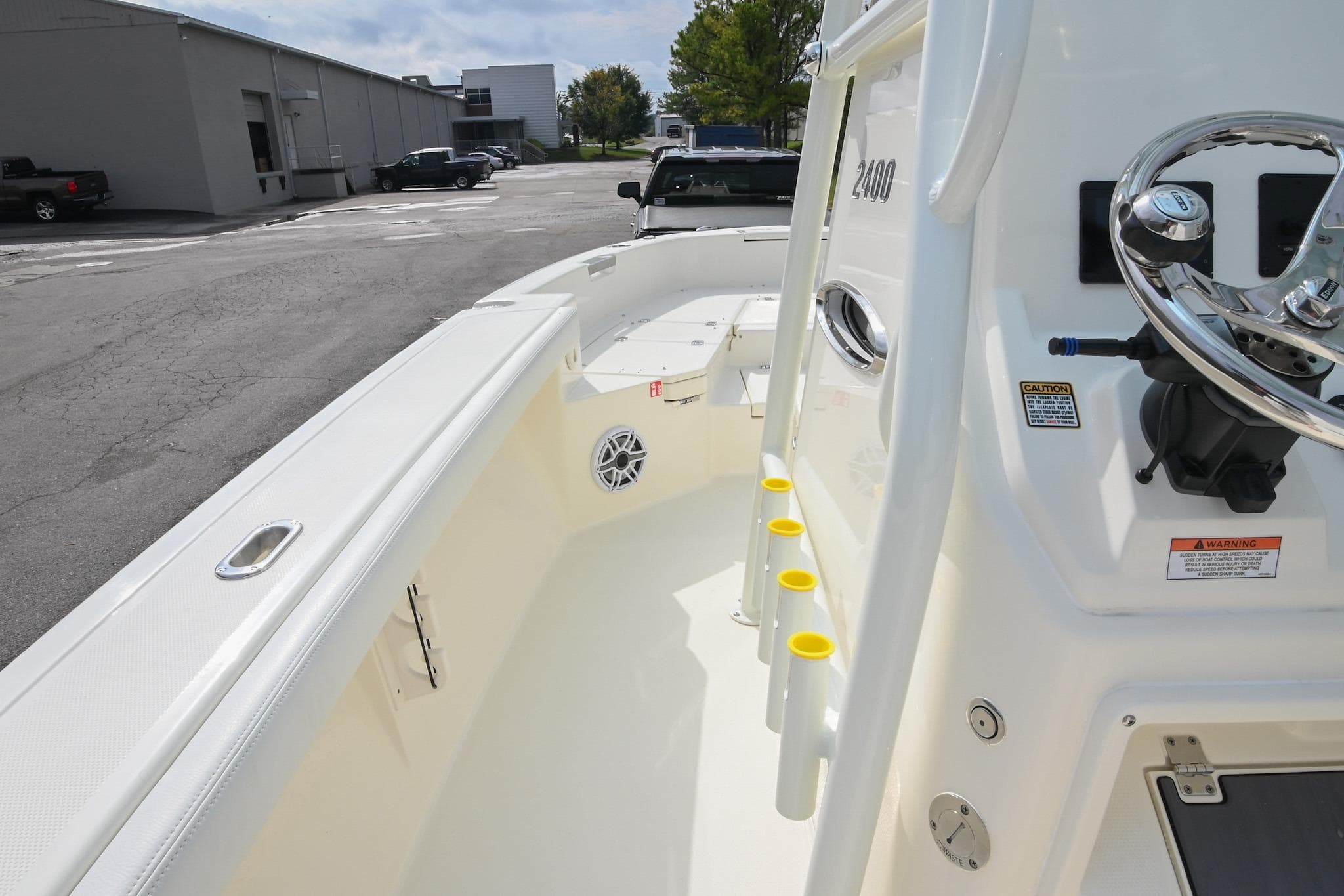 2026 Pathfinder 2400 TRS boat interior with steering wheel and rod holders.