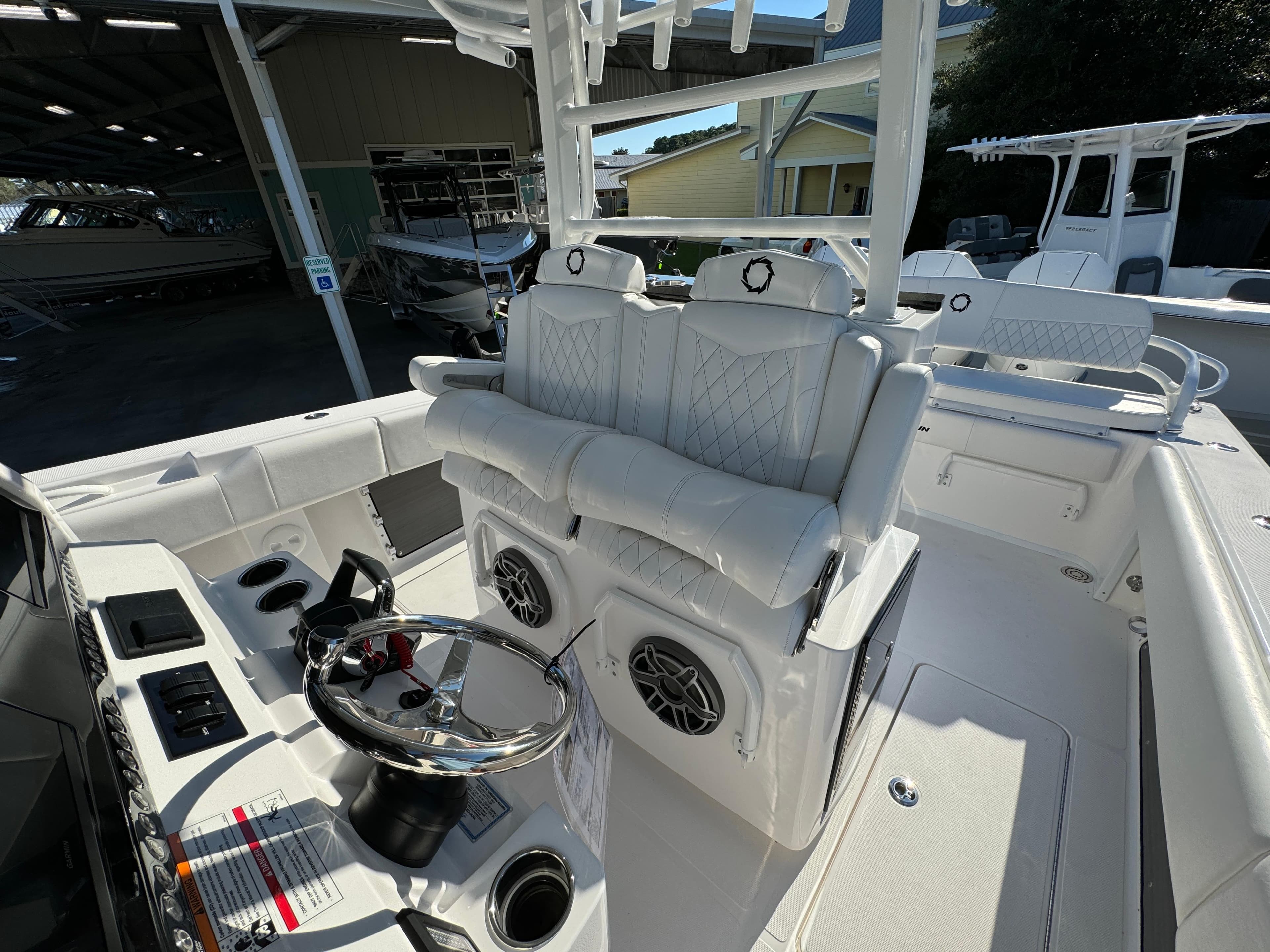 2025 Fountain 38TE boat interior with white seating and modern steering console.