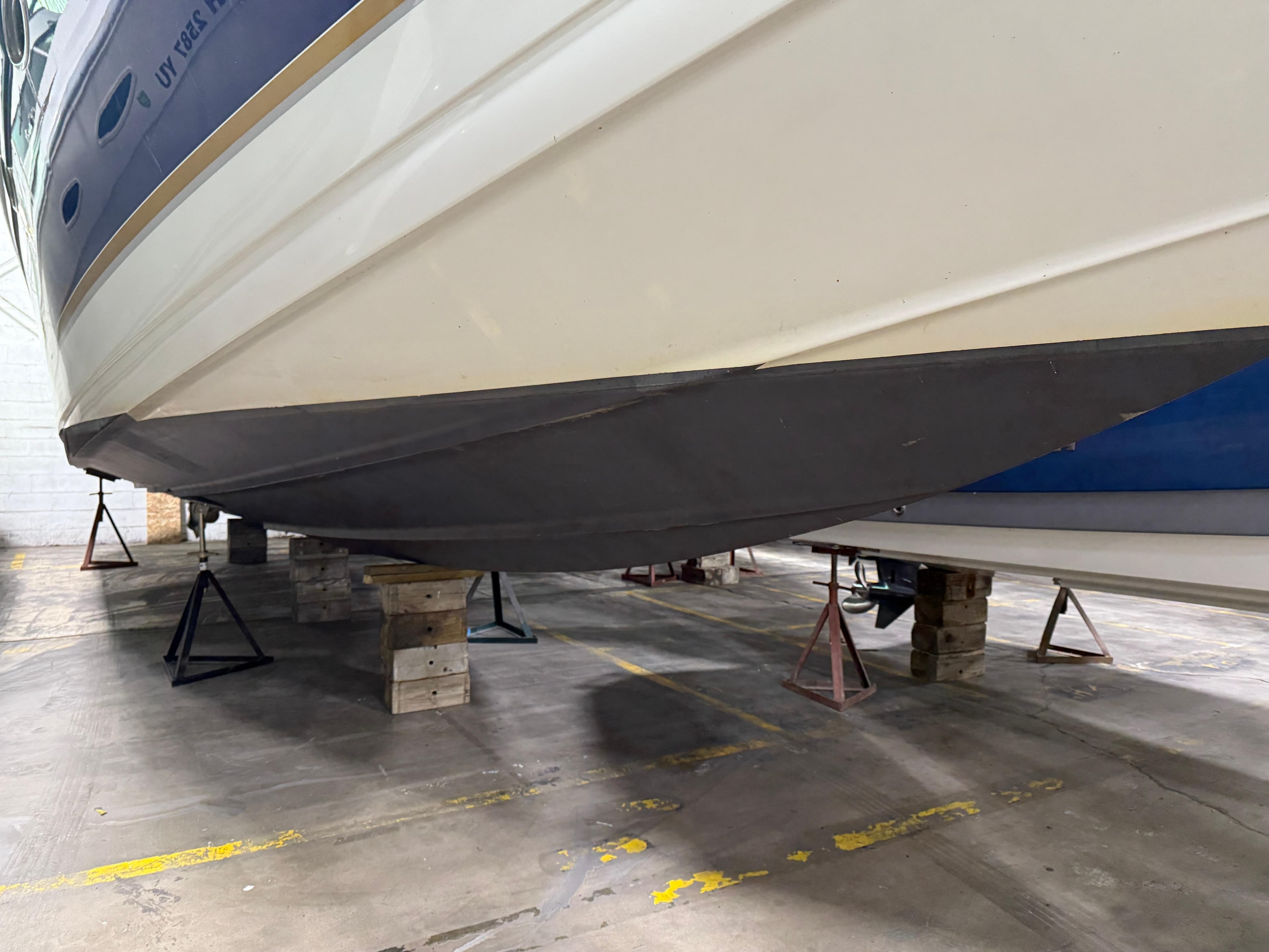 2002 Formula 400 Super Sport boat on stands in a warehouse.