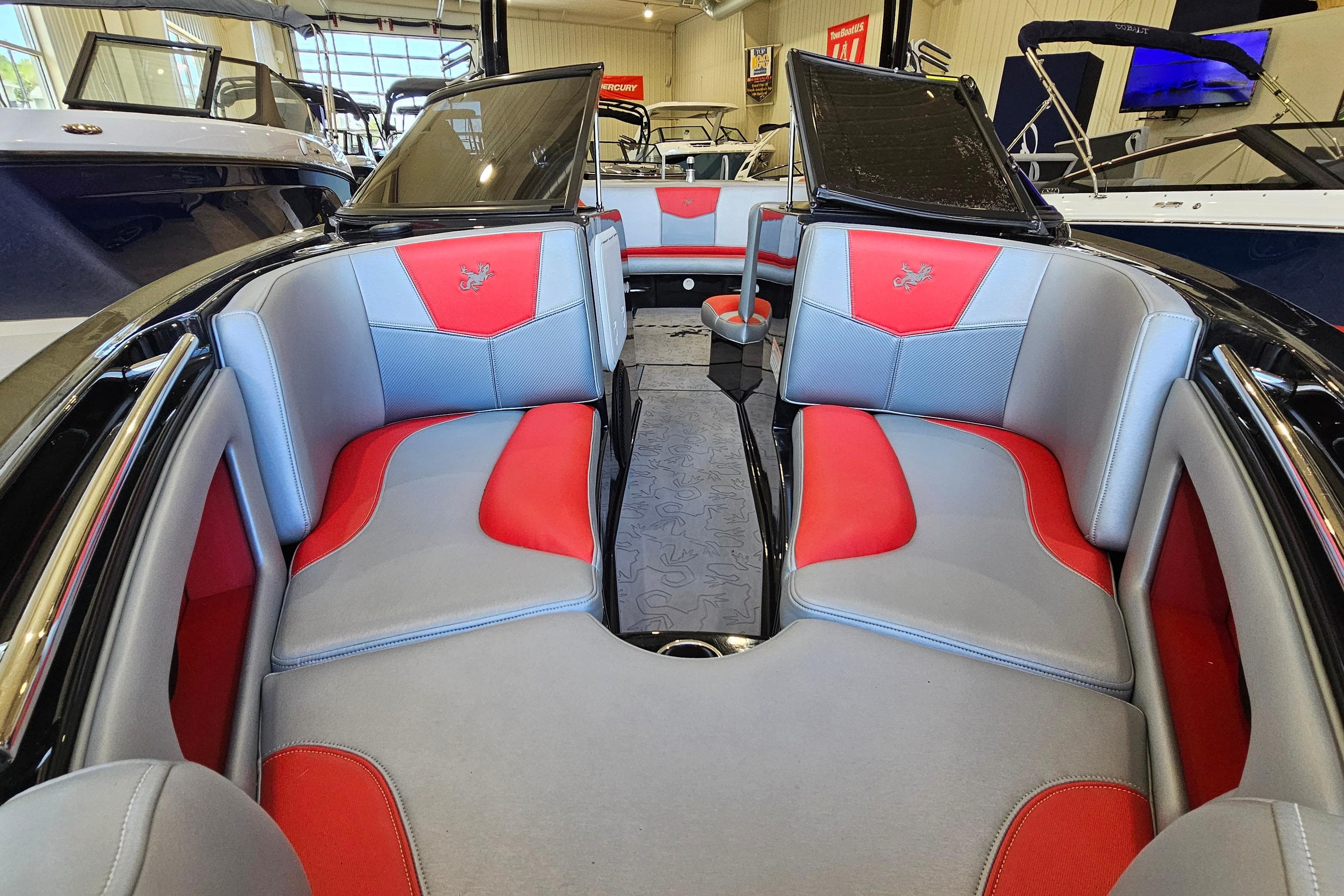 Interior of 2017 Gekko Revo 7.1 boat with red and gray seating.