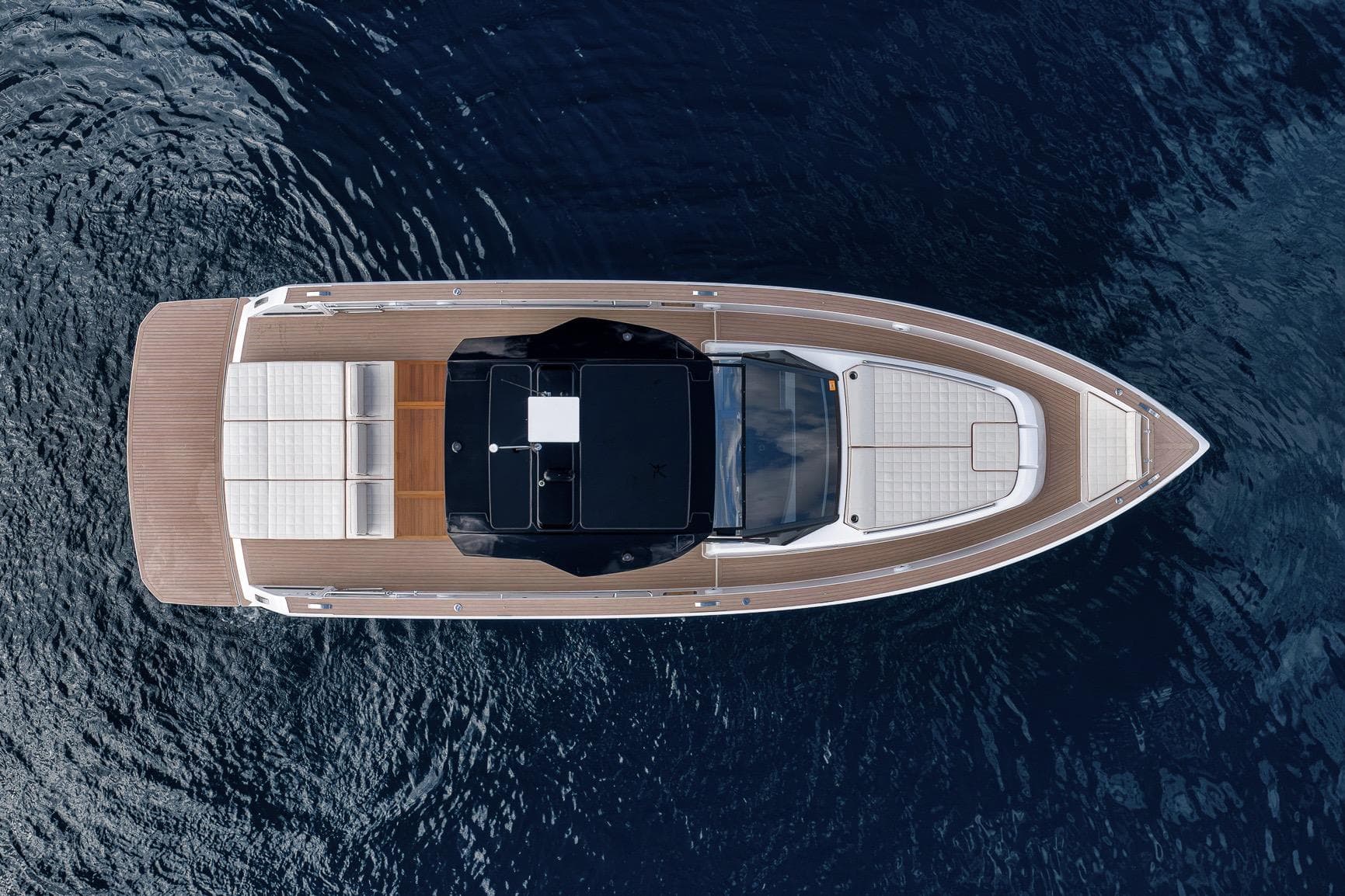Aerial view of 2023 Pardo Yachts P43 luxury yacht on calm water.