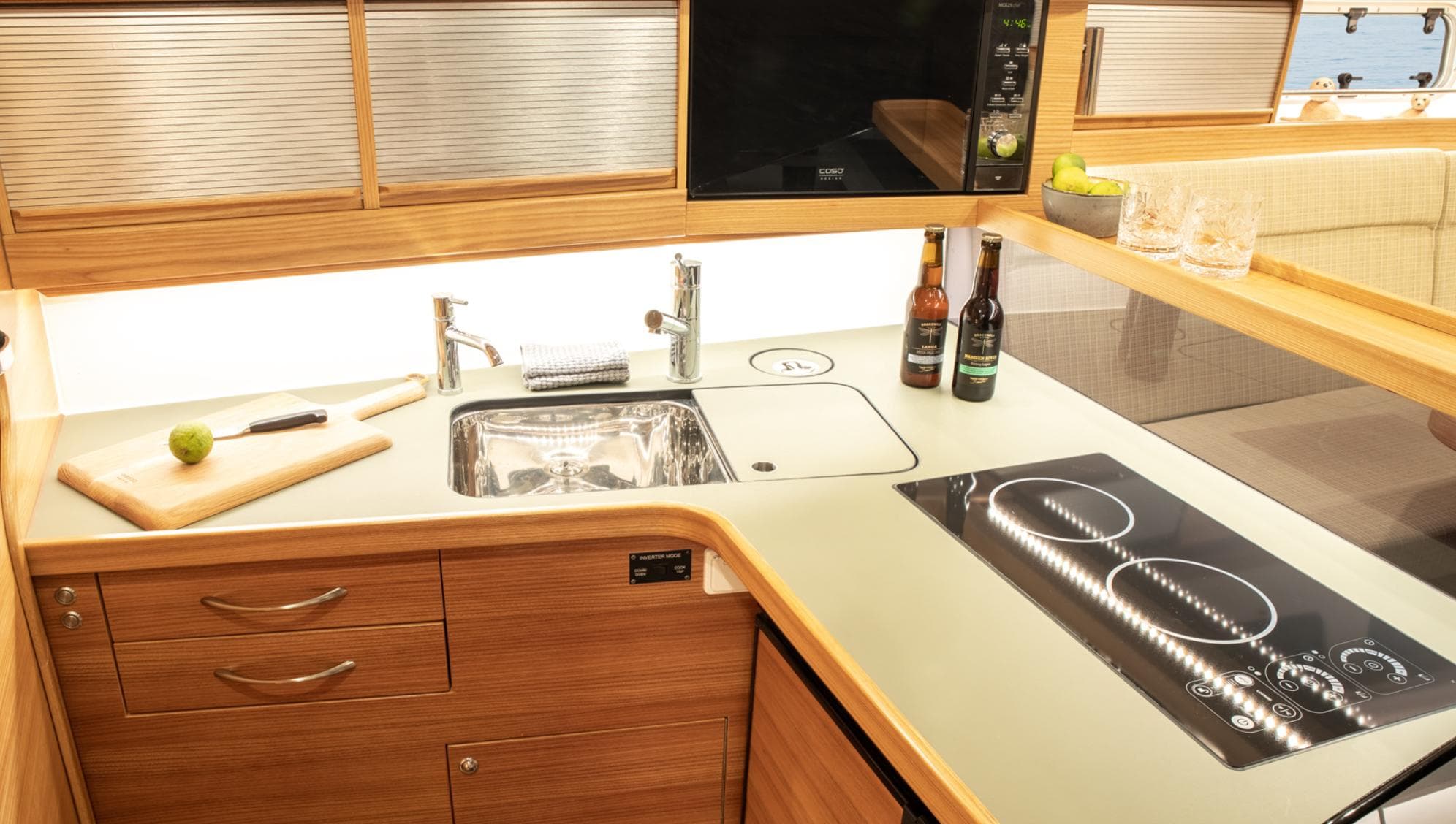 Modern kitchen in 2026 Dragonfly 40 yacht with sleek design and appliances.