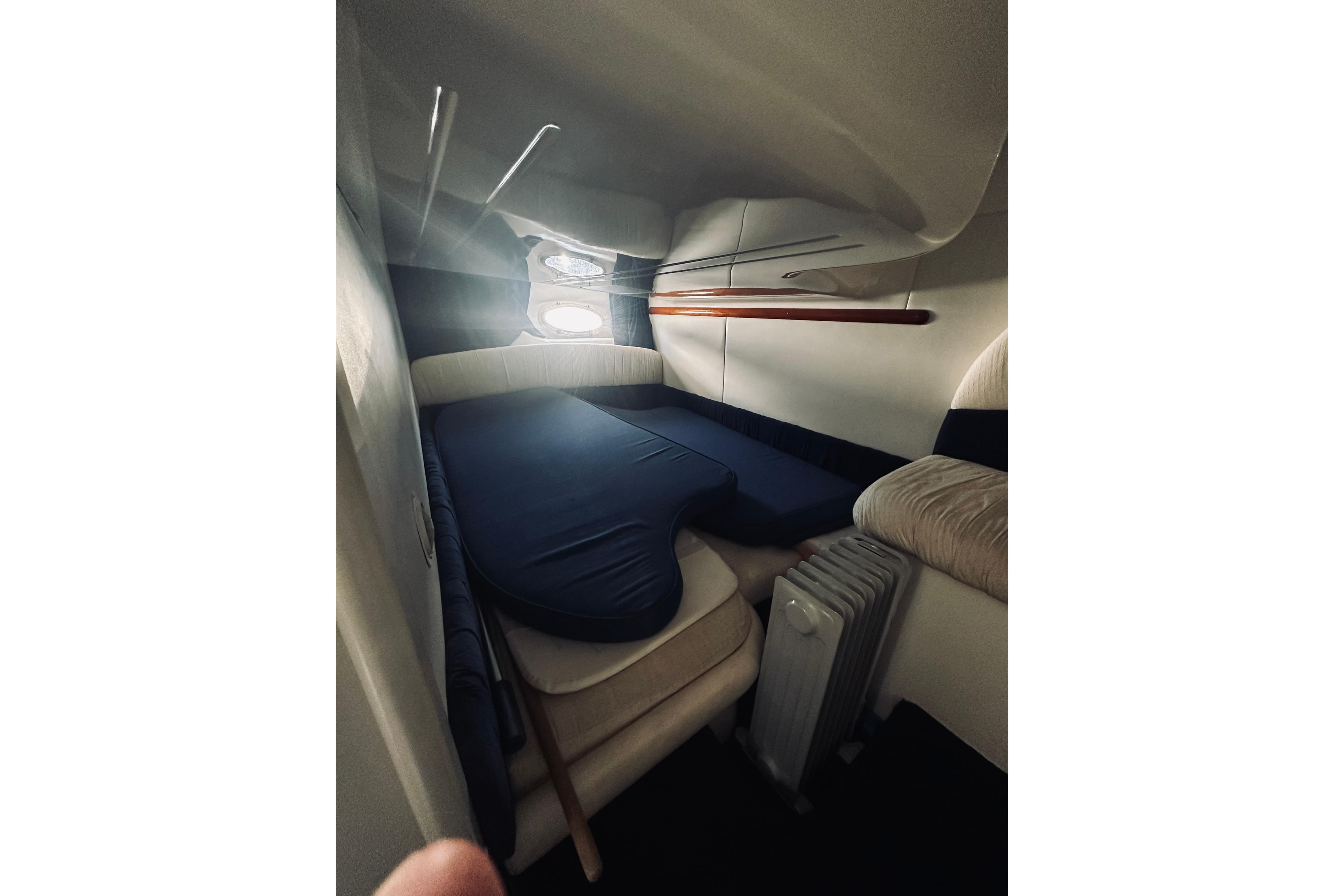 Interior cabin of 1999 Cranchi Endurance 39 yacht with cozy seating and natural light.