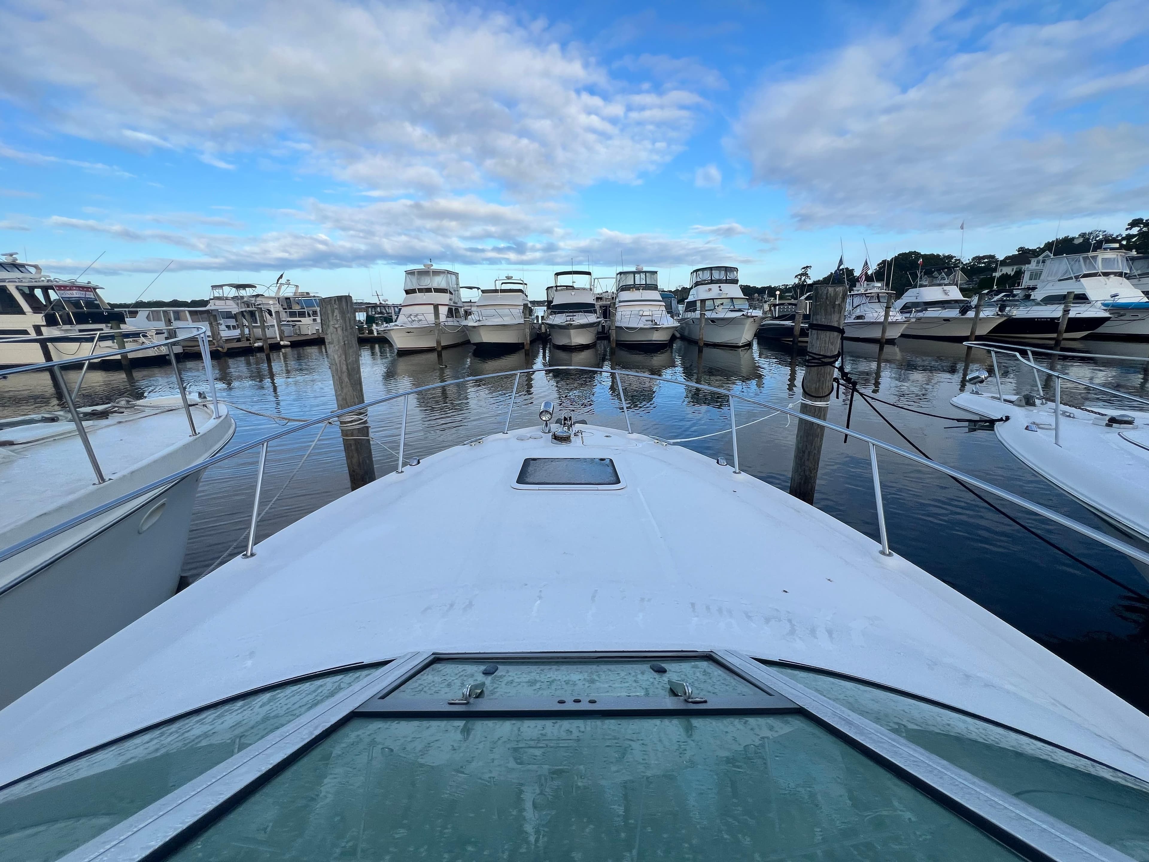 2007 Sea Ray 290 Amberjack docked in a marina with multiple boats.