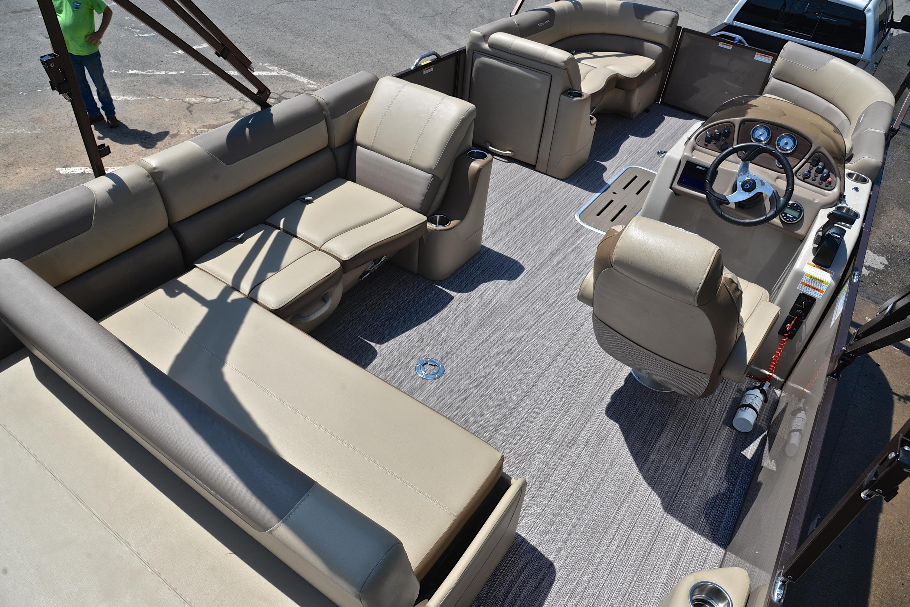 2020 Veranda VR22 pontoon boat interior with beige seating and modern dashboard.