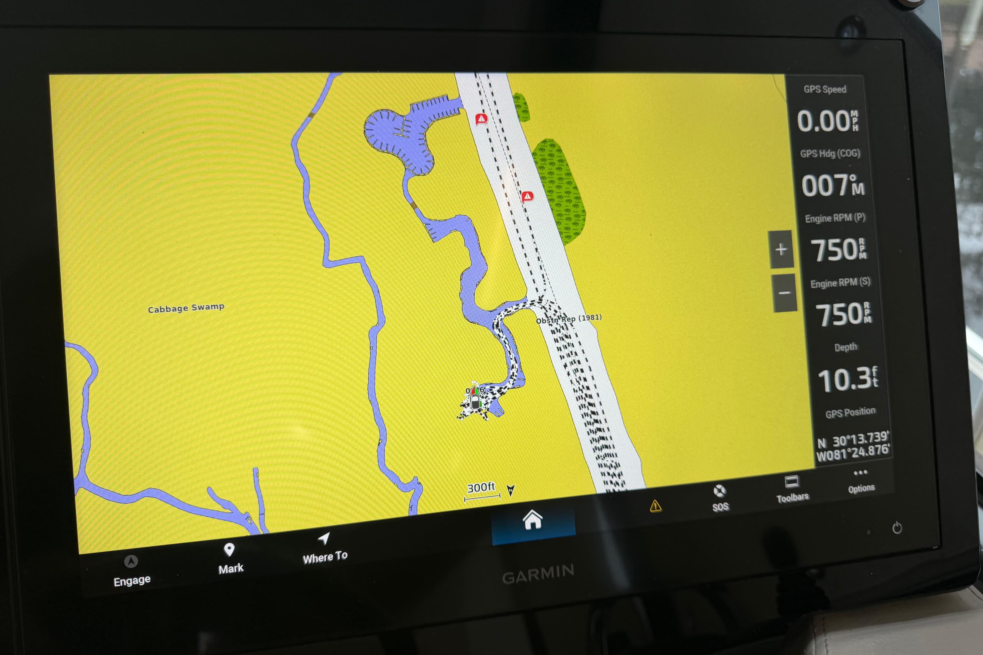 Garmin navigation display on 2021 Regal 36 XO boat, showing map and engine data.