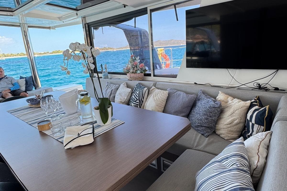 Luxurious interior of 2021 Bali 5.4 Open Space yacht with ocean view and elegant decor.