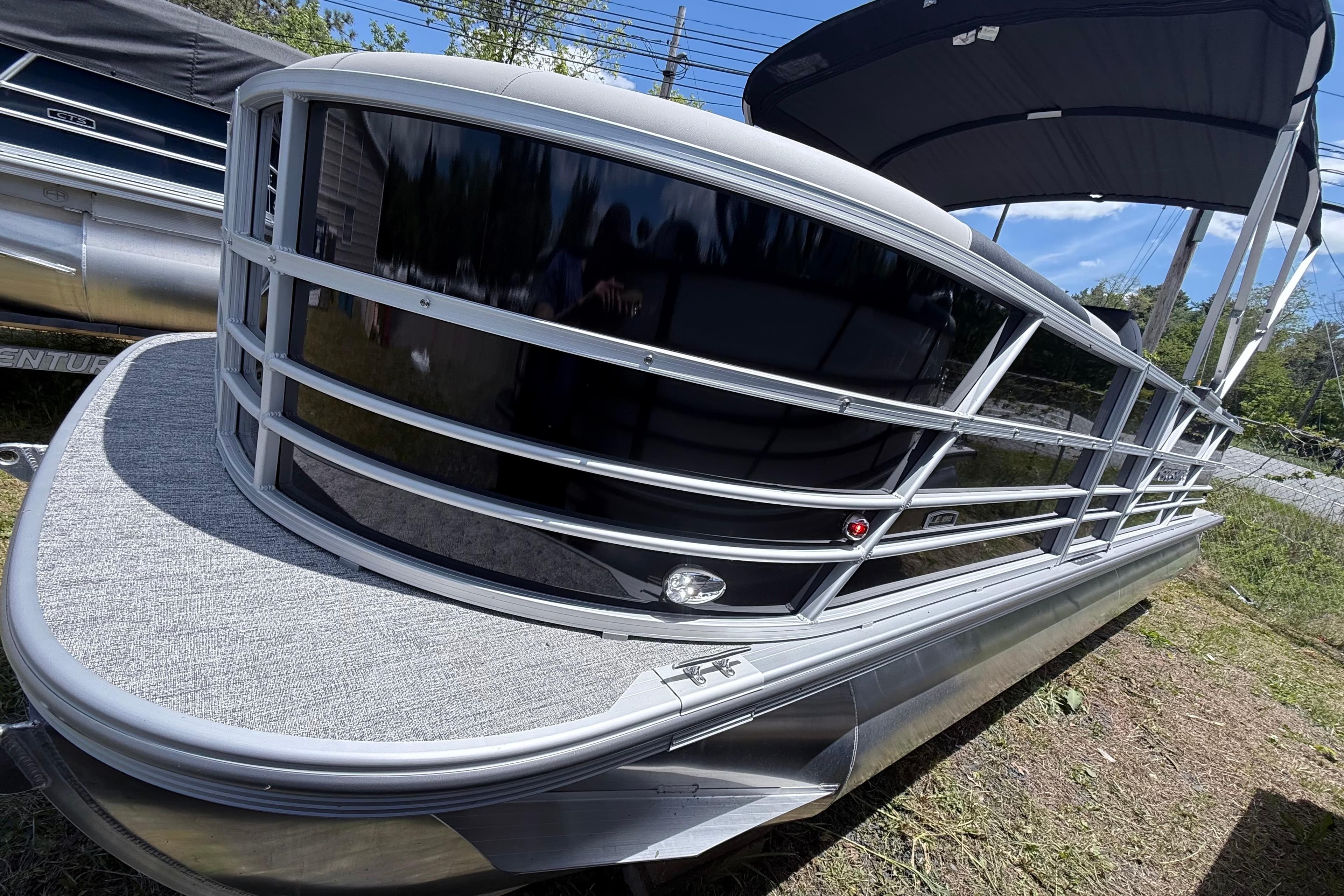 2026 Berkshire 24RFX LE pontoon boat with sleek design and canopy.