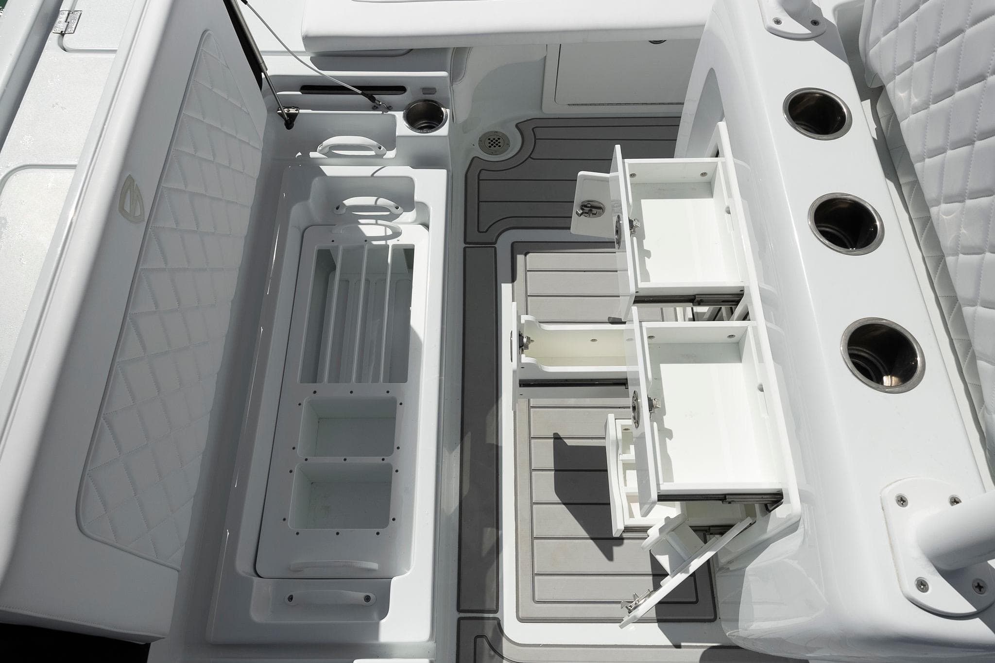 2026 Barker Boatworks 26 Calibogue Bay interior with storage compartments and rod holders.