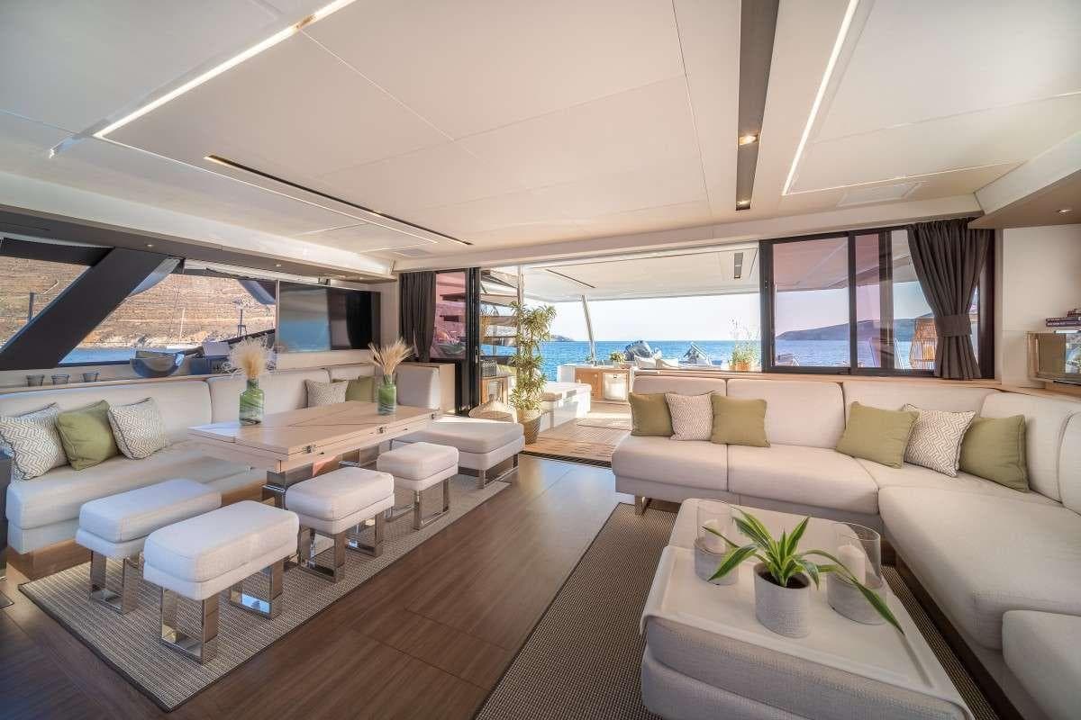 Luxurious interior of 2019 Fountaine Pajot Alegria 67 yacht with elegant seating and ocean view.