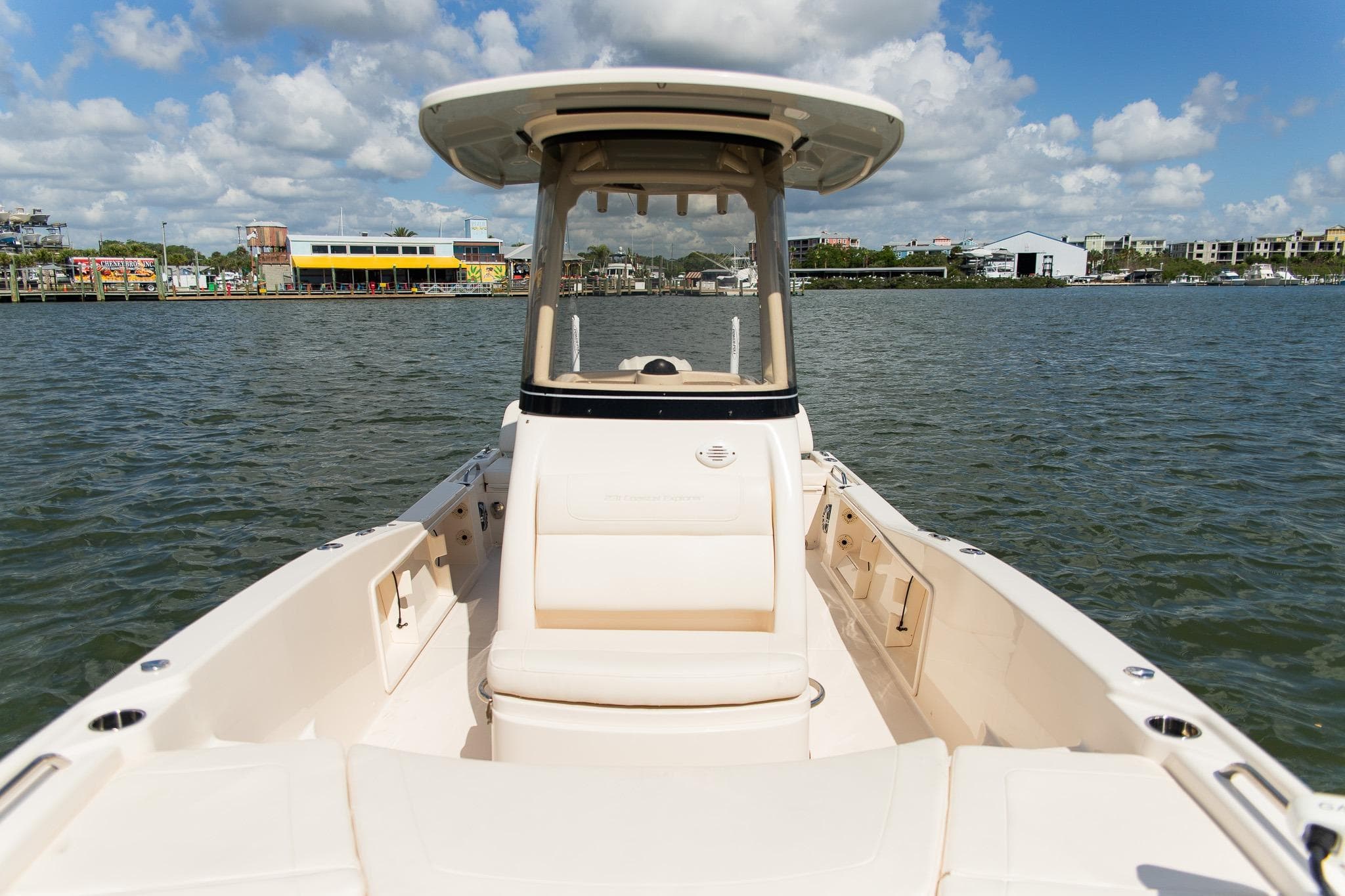 2024 Grady-White 231 Coastal Explorer boat on water, showcasing spacious deck and helm.