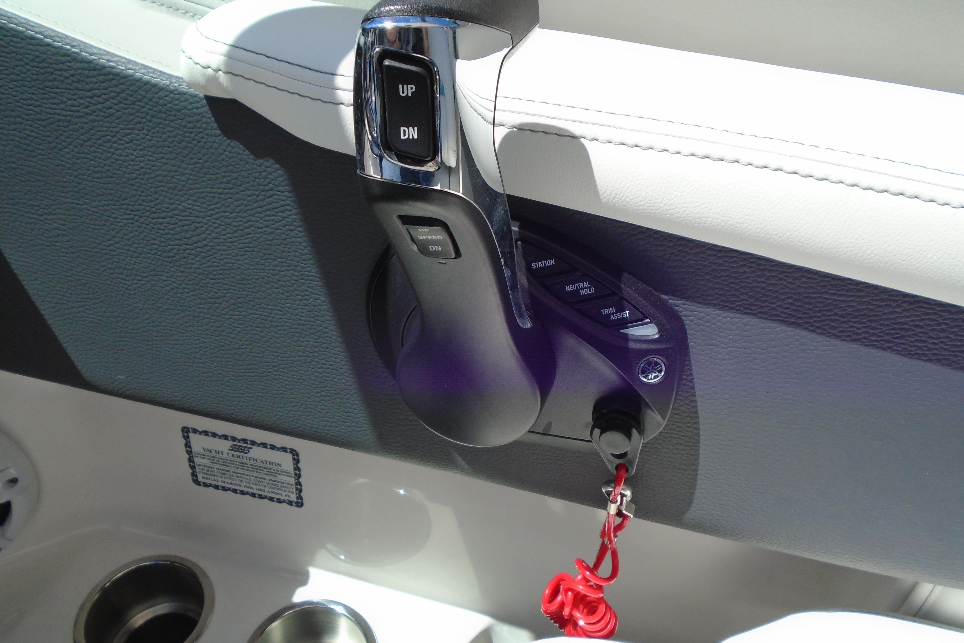 2022 Regal LX6 boat throttle control with trim assist and safety lanyard.
