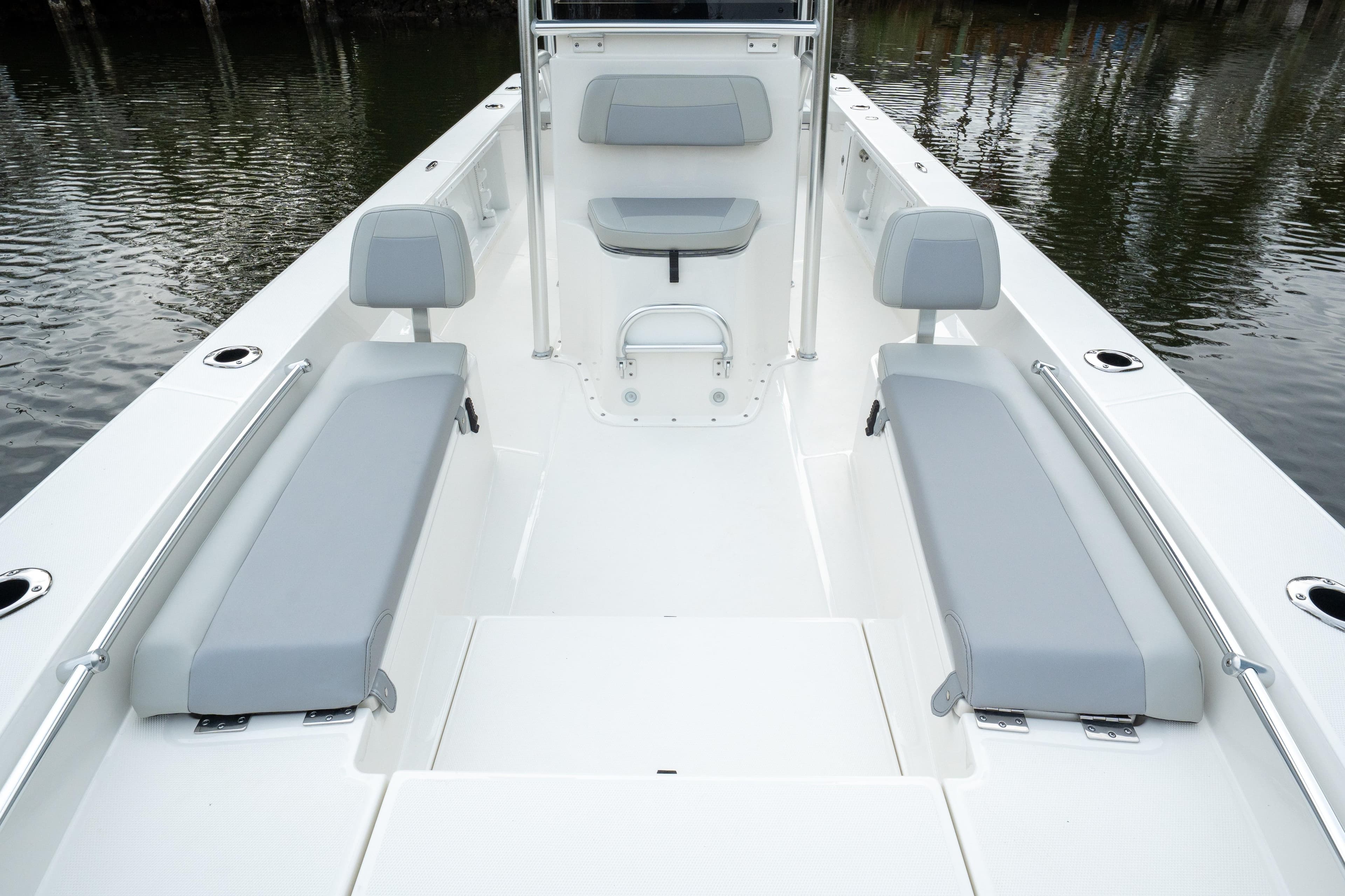 2026 Bay Rider 2260 FS Skiff interior with gray seating, spacious deck, and water backdrop.