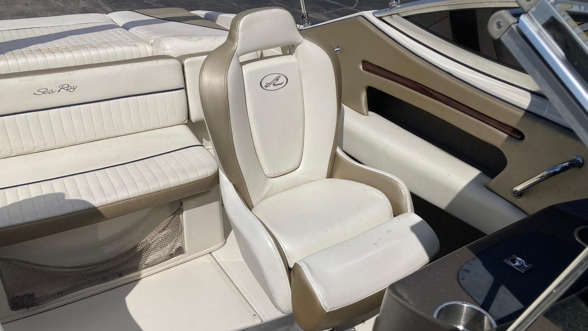 2007 Sea Ray 210 Select boat interior with white and beige seating.