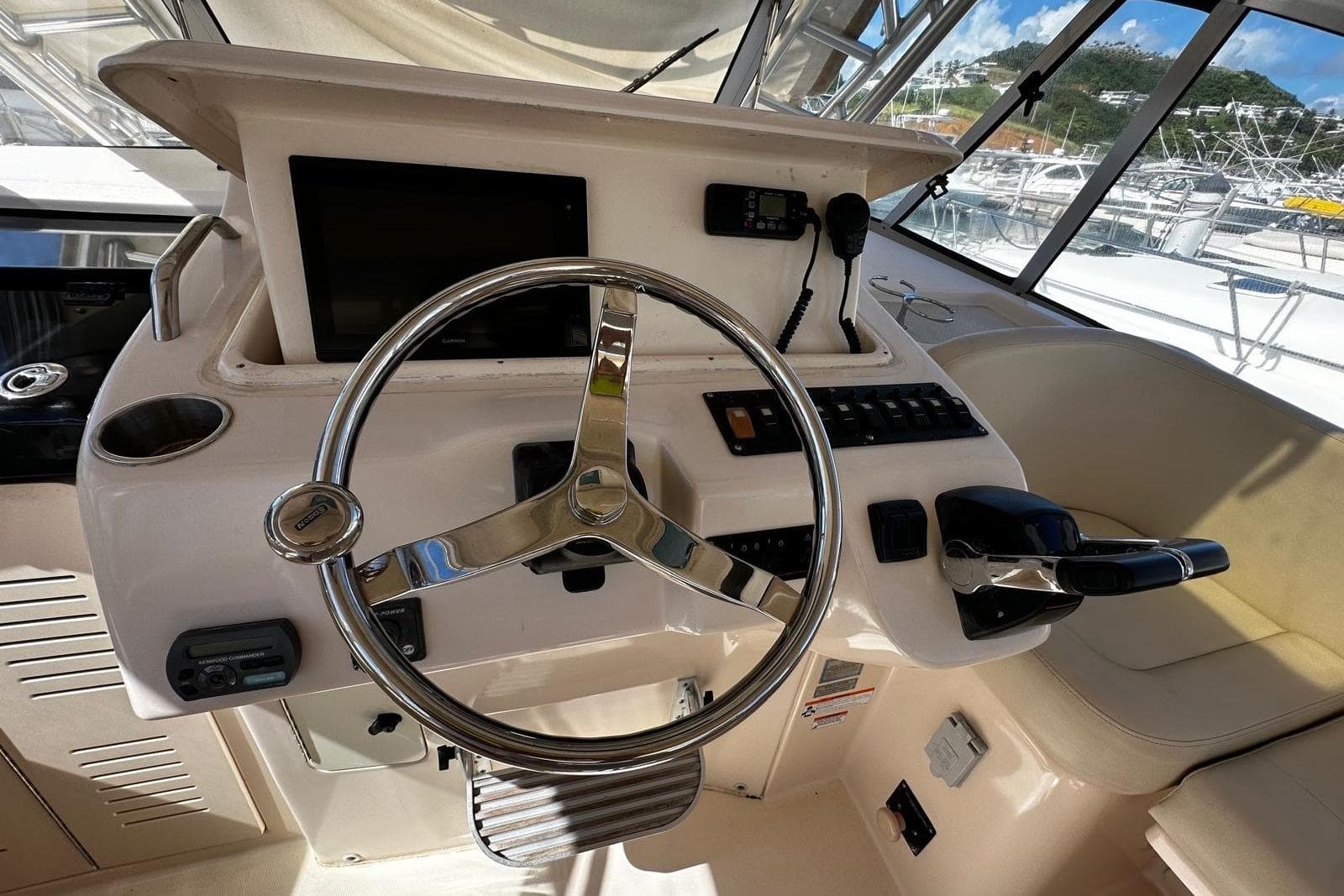2008 Grady-White Express 330 helm with steering wheel and control panel.