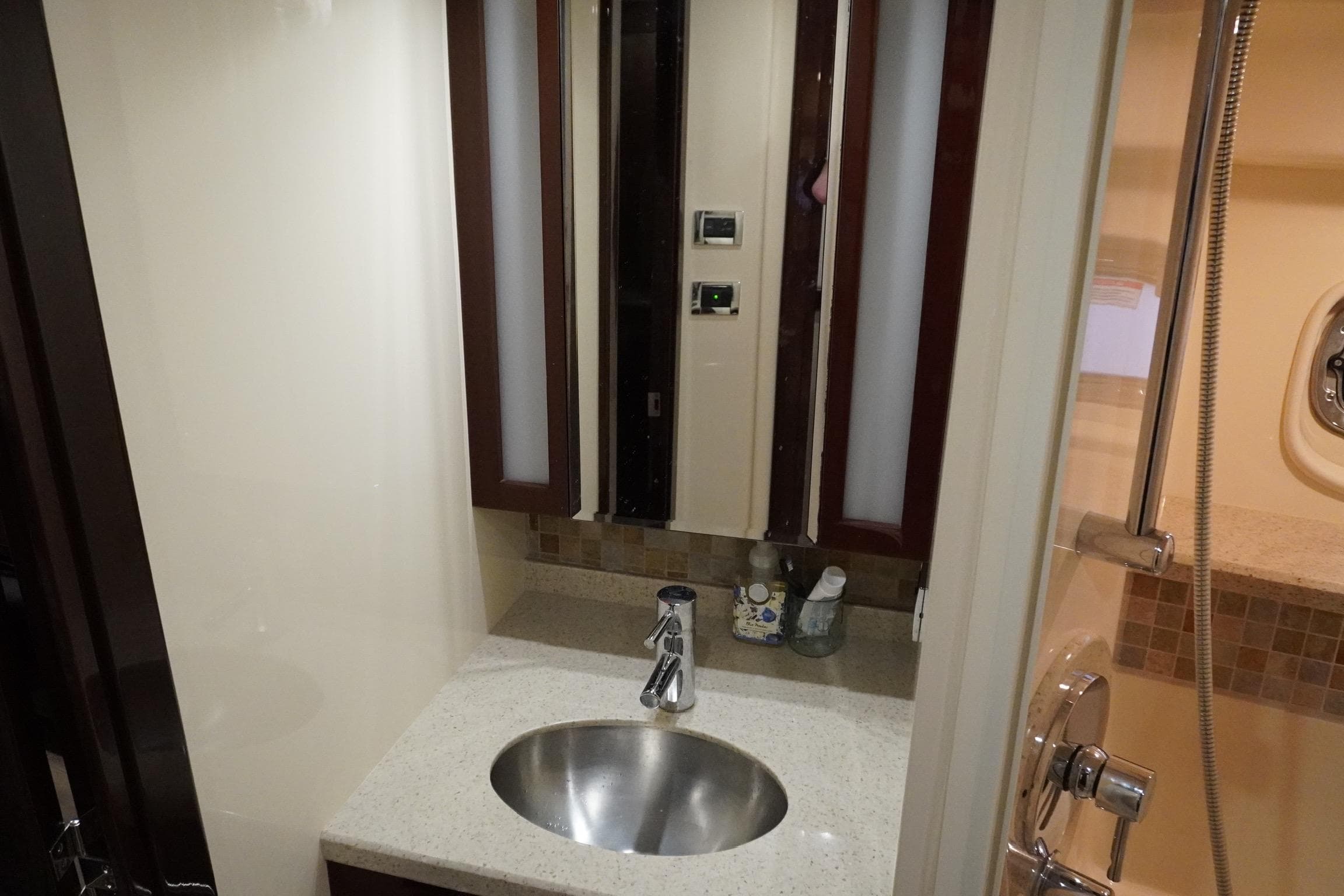Luxurious bathroom in 2009 Sea Ray 47 Sedan Bridge yacht with modern fixtures.