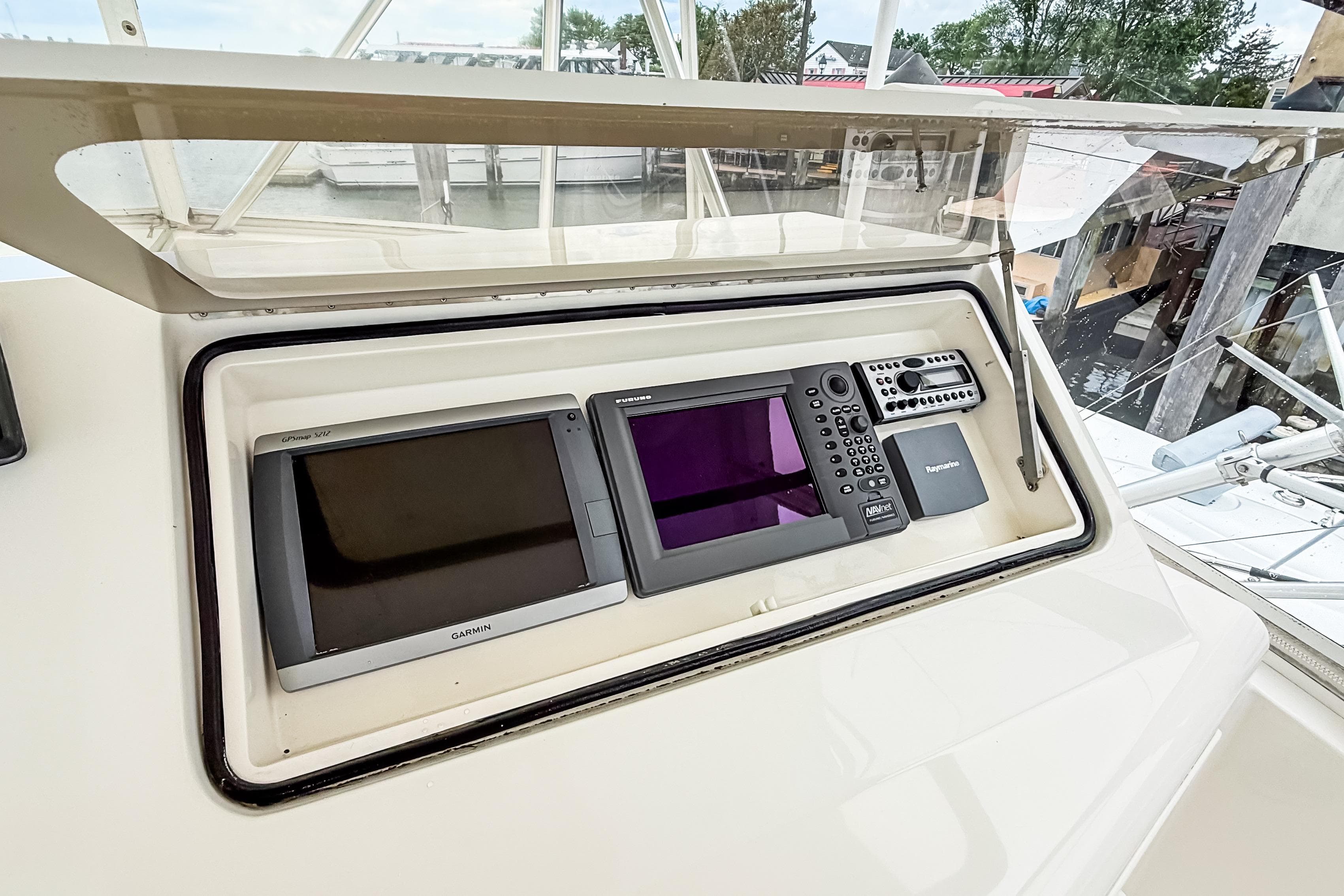Control panel of a 2004 Ocean Yachts 50 Super Sport with navigation equipment.