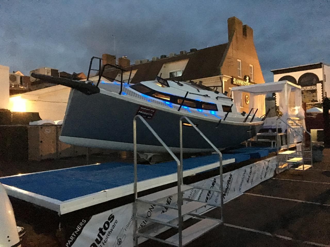 2025 Faro Yachts 29 displayed on a platform at dusk, with blue accent lighting.