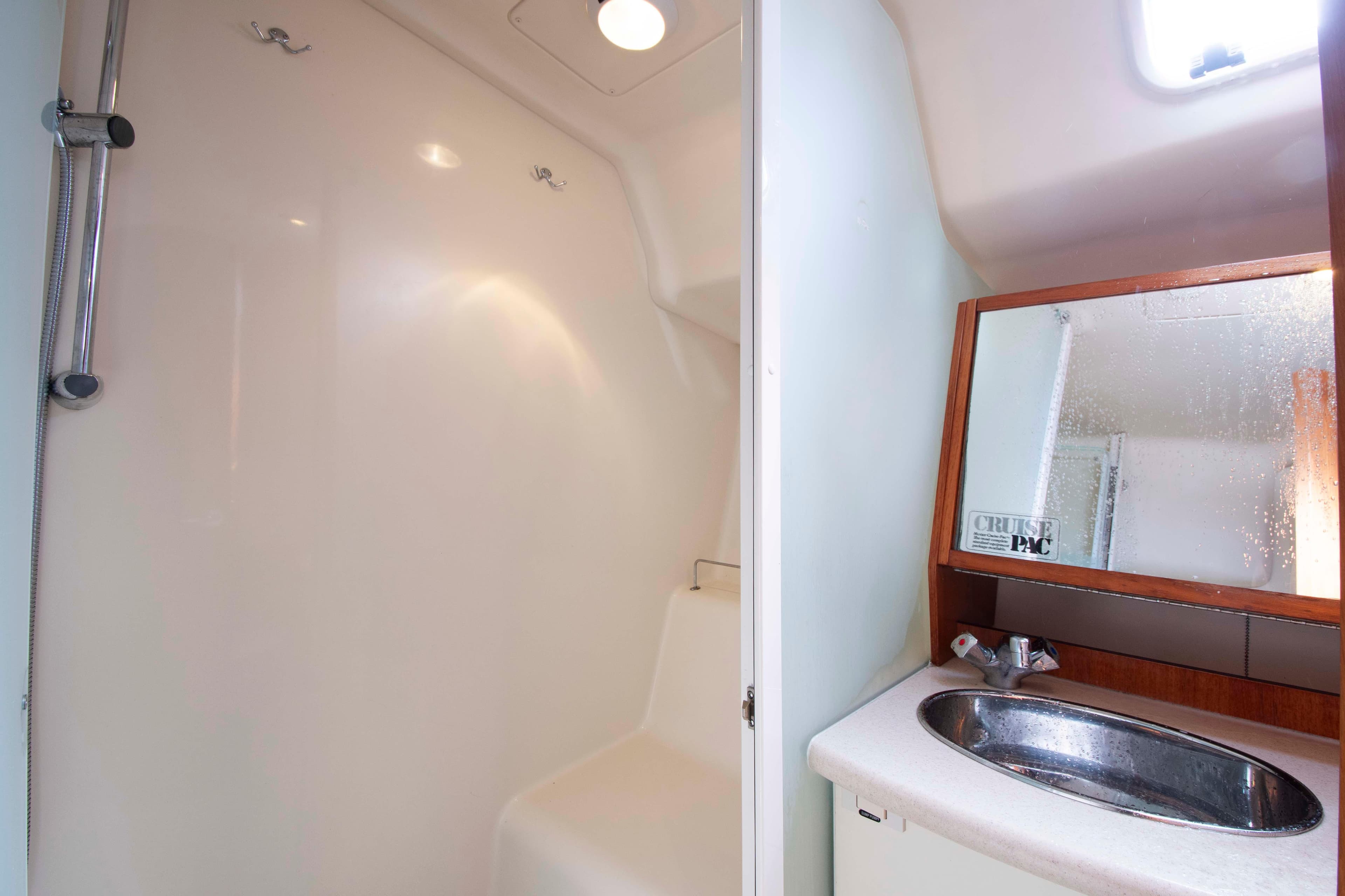 2005 Hunter 45 CC yacht bathroom with shower and sink.
