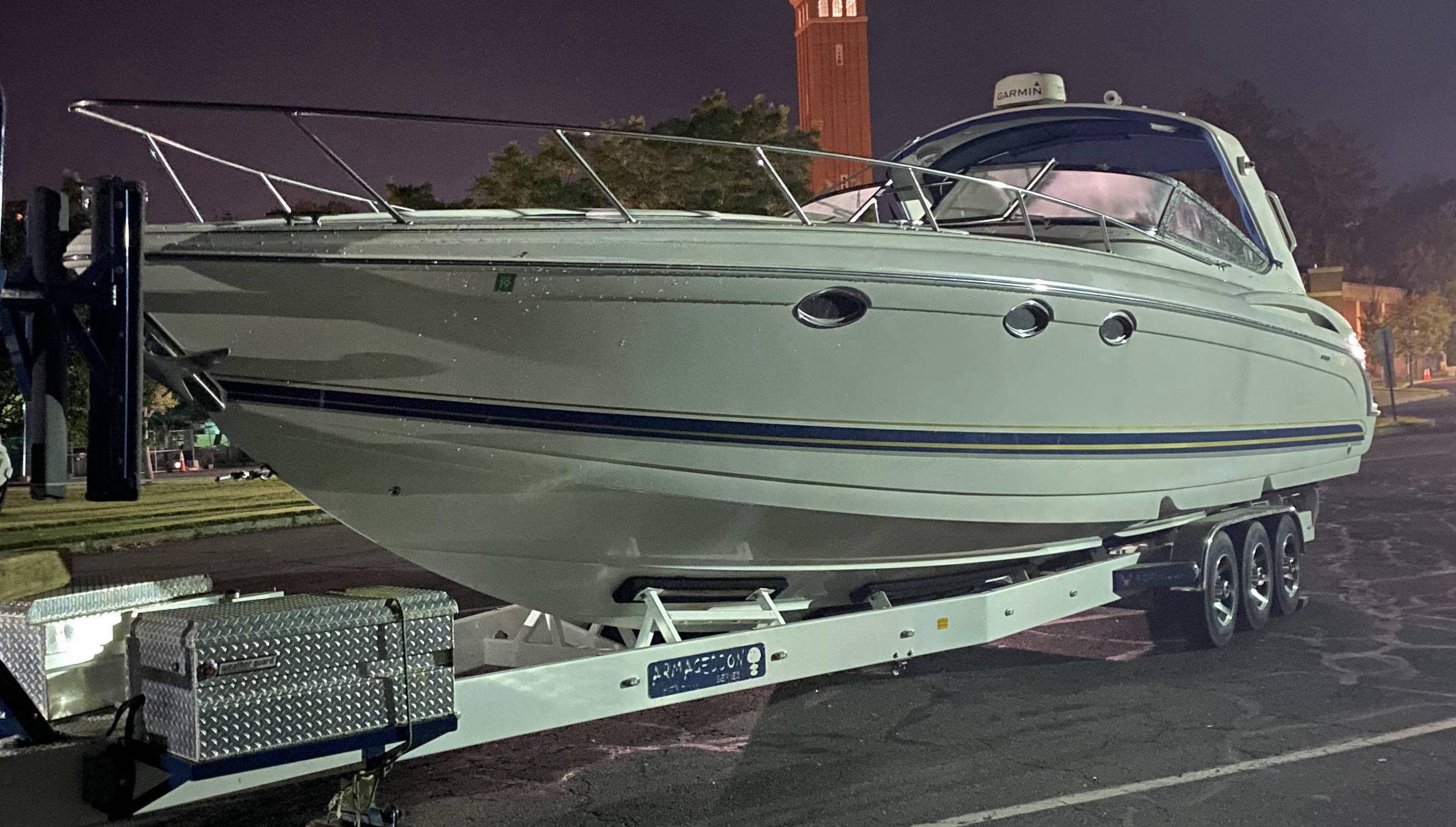 2000 Formula 400 SS boat on a trailer at night.