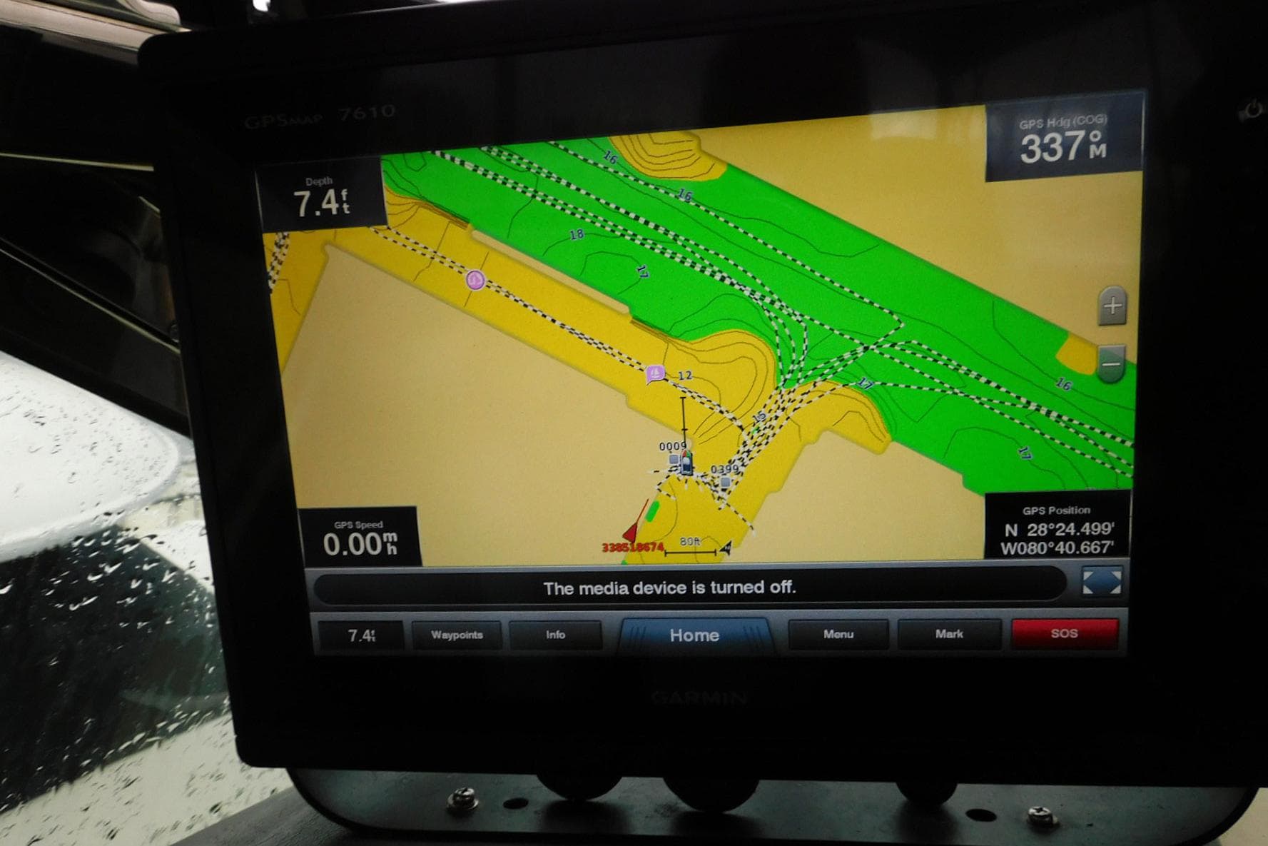GPS navigation screen on a 2002 Carver 570 Voyager Pilothouse, showing map and coordinates.