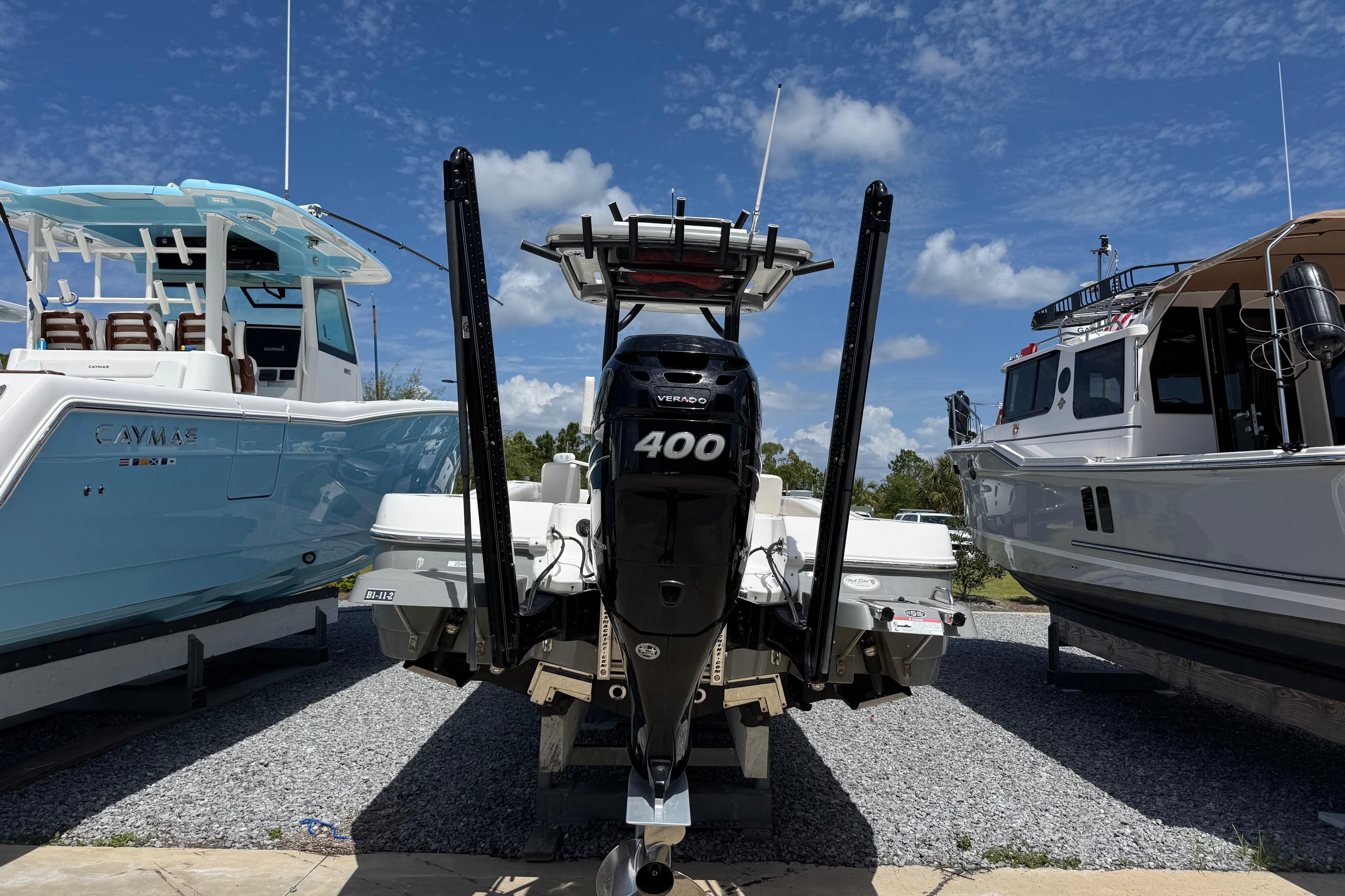 2022 Caymas 26 HB boat with powerful 400 horsepower engine, displayed outdoors.
